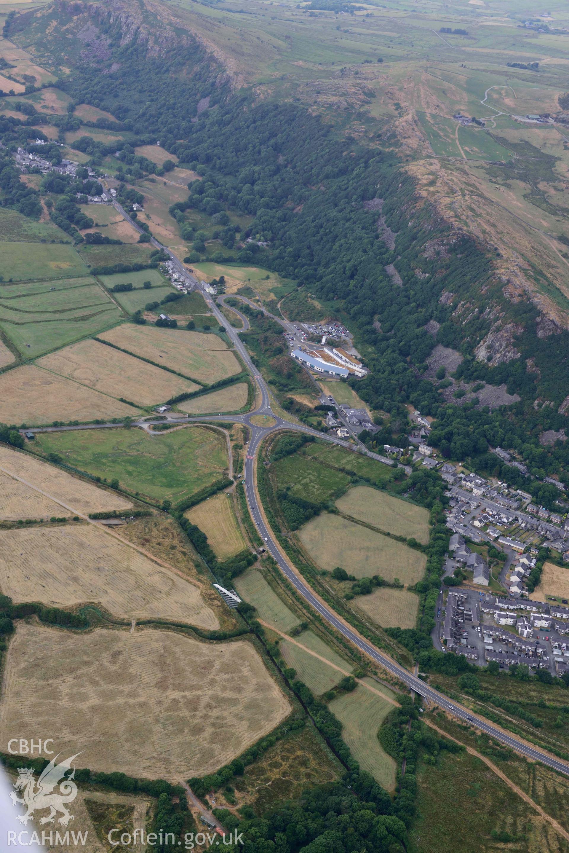 Roman bath house and surrounding landscape around Tremadog. Oblique aerial photograph taken during the Royal Commission’s programme of archaeological aerial reconnaissance by Toby Driver on 10 July 2018.