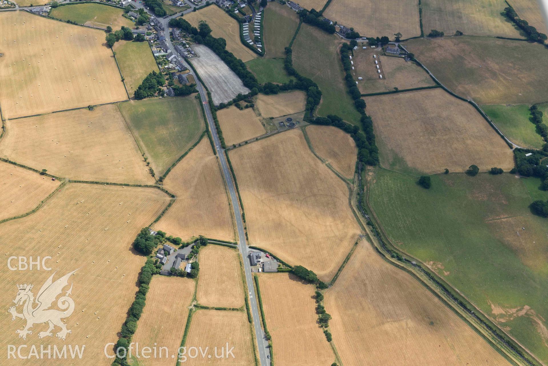 Bryncrug cropmark complex, south-west area. Oblique aerial photograph taken during the Royal Commission’s programme of archaeological aerial reconnaissance by Toby Driver on 10 July 2018.