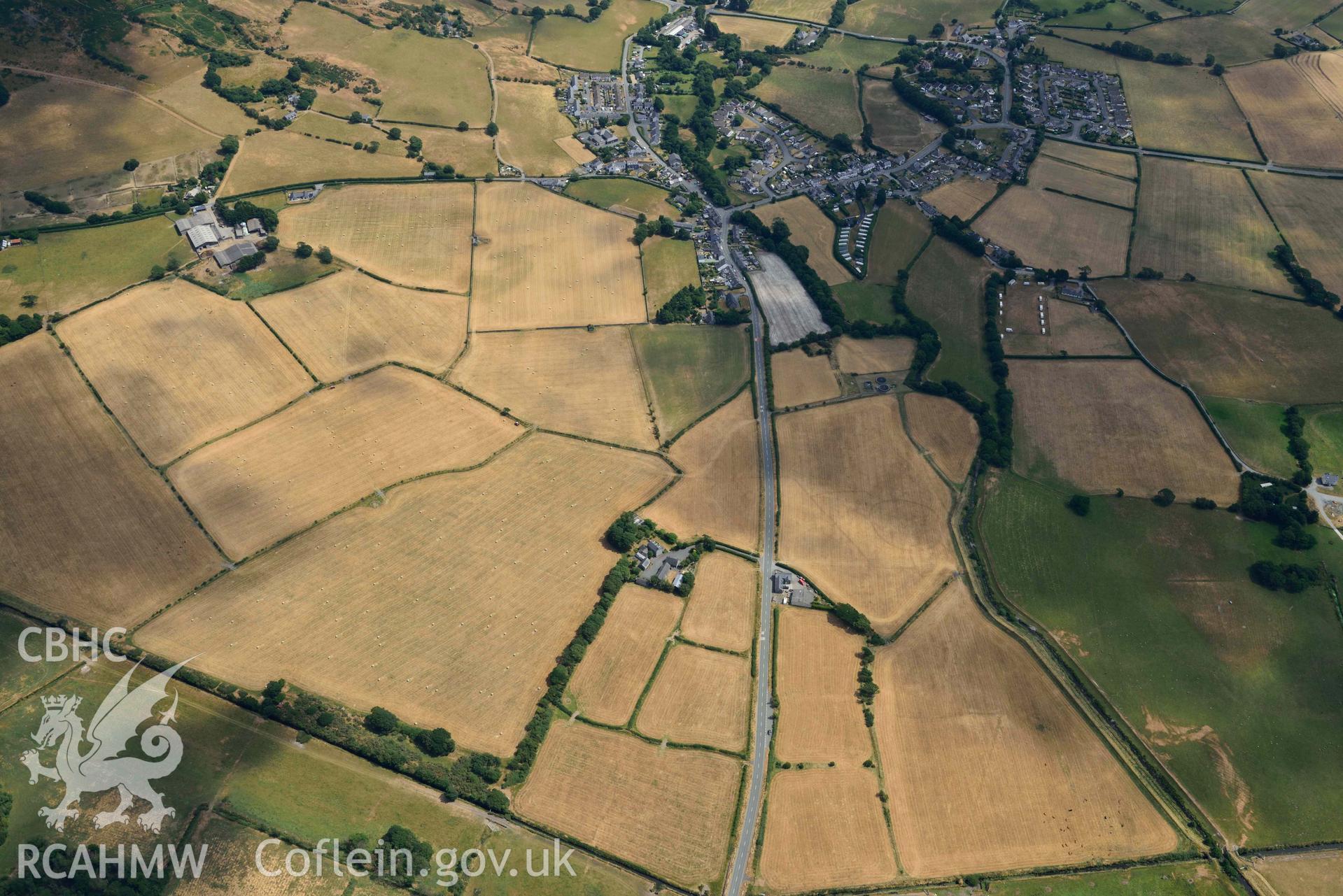 Bryncrug cropmark complex, south-west area, and enclosures to the est of Gwyddelfynydd. Oblique aerial photograph taken during the Royal Commission’s programme of archaeological aerial reconnaissance by Toby Driver on 10 July 2018.