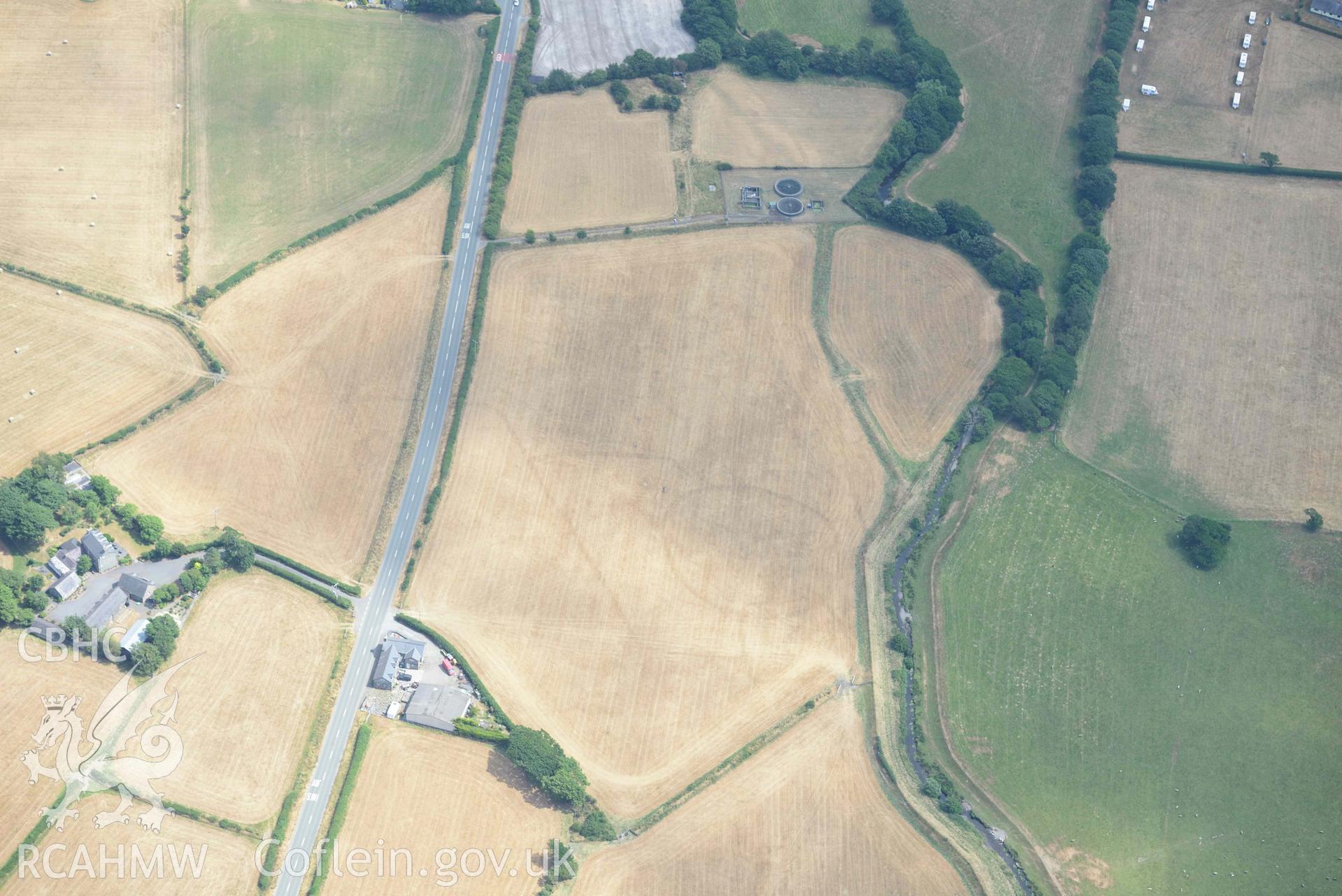 Bryncrug cropmark complex, south-west area. Oblique aerial photograph taken during the Royal Commission’s programme of archaeological aerial reconnaissance by Toby Driver on 10 July 2018.