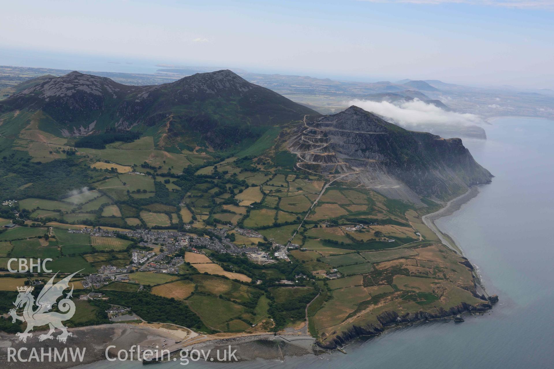 Trefor village, Trefor (yr Eifl) quarry, and the surrounding landscape. Oblique aerial photograph taken during the Royal Commission’s programme of archaeological aerial reconnaissance by Toby Driver on 10 July 2018.