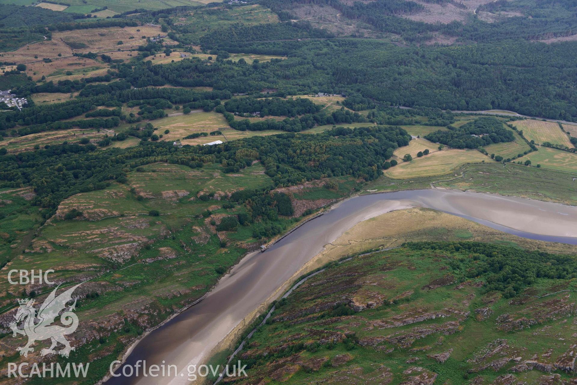 Tyddyn Isa slate quay and surrounding landscape. Oblique aerial photograph taken during the Royal Commission’s programme of archaeological aerial reconnaissance by Toby Driver on 10 July 2018.