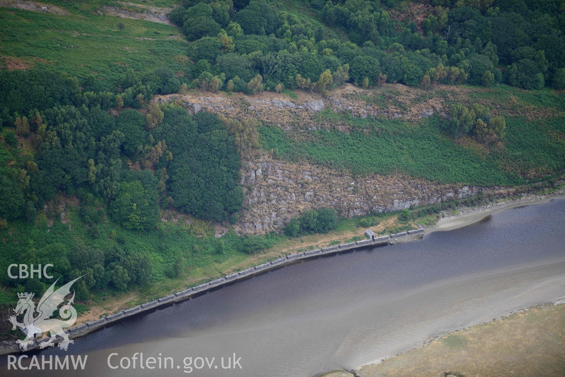 Close-up view of Tyddyn Isa slate quay. Oblique aerial photograph taken during the Royal Commission’s programme of archaeological aerial reconnaissance by Toby Driver on 10 July 2018.