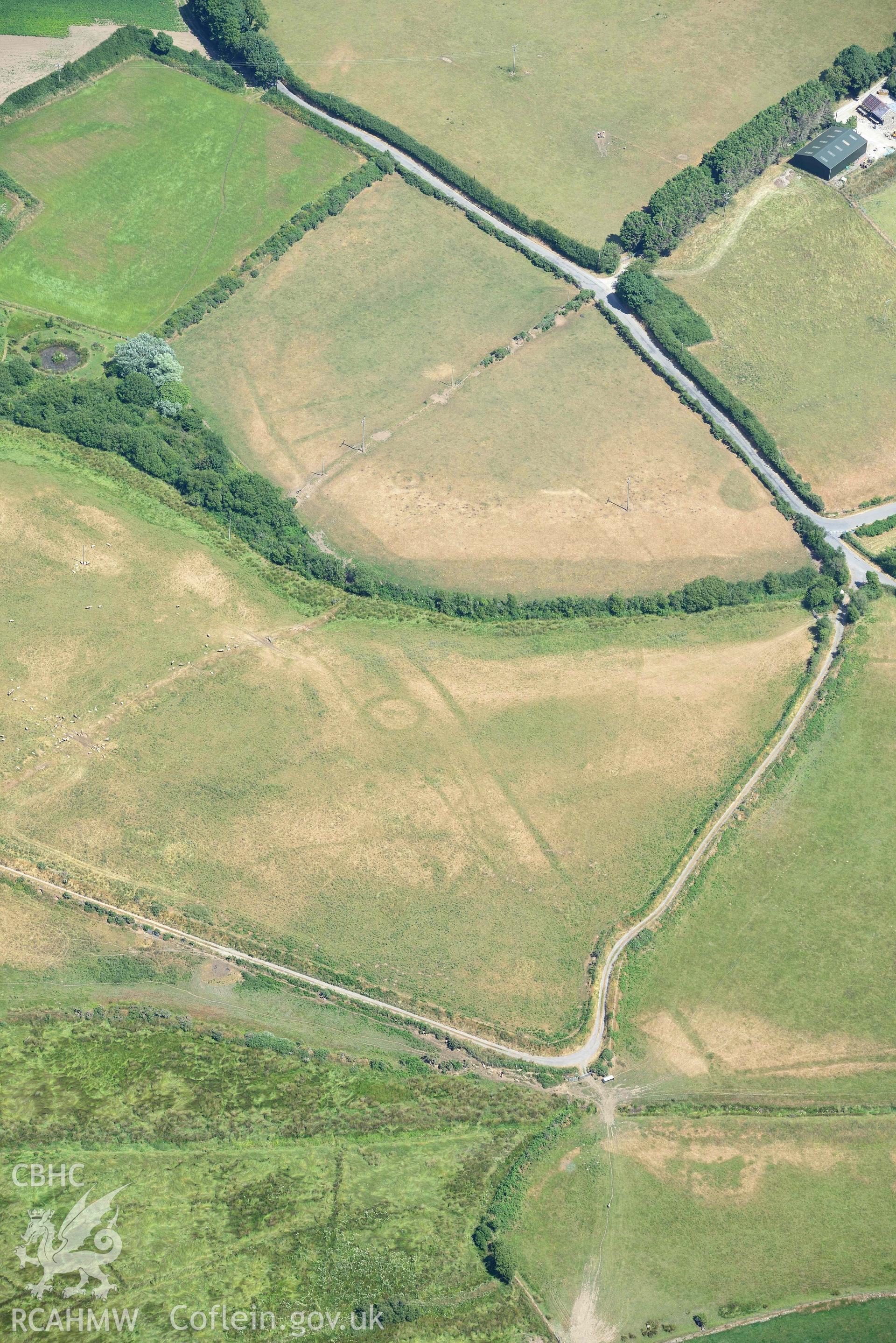 Detailed view of cropmark complex at Llawr-Dref, Llangian. Oblique aerial photograph taken during the Royal Commission’s programme of archaeological aerial reconnaissance by Toby Driver on 10 July 2018.