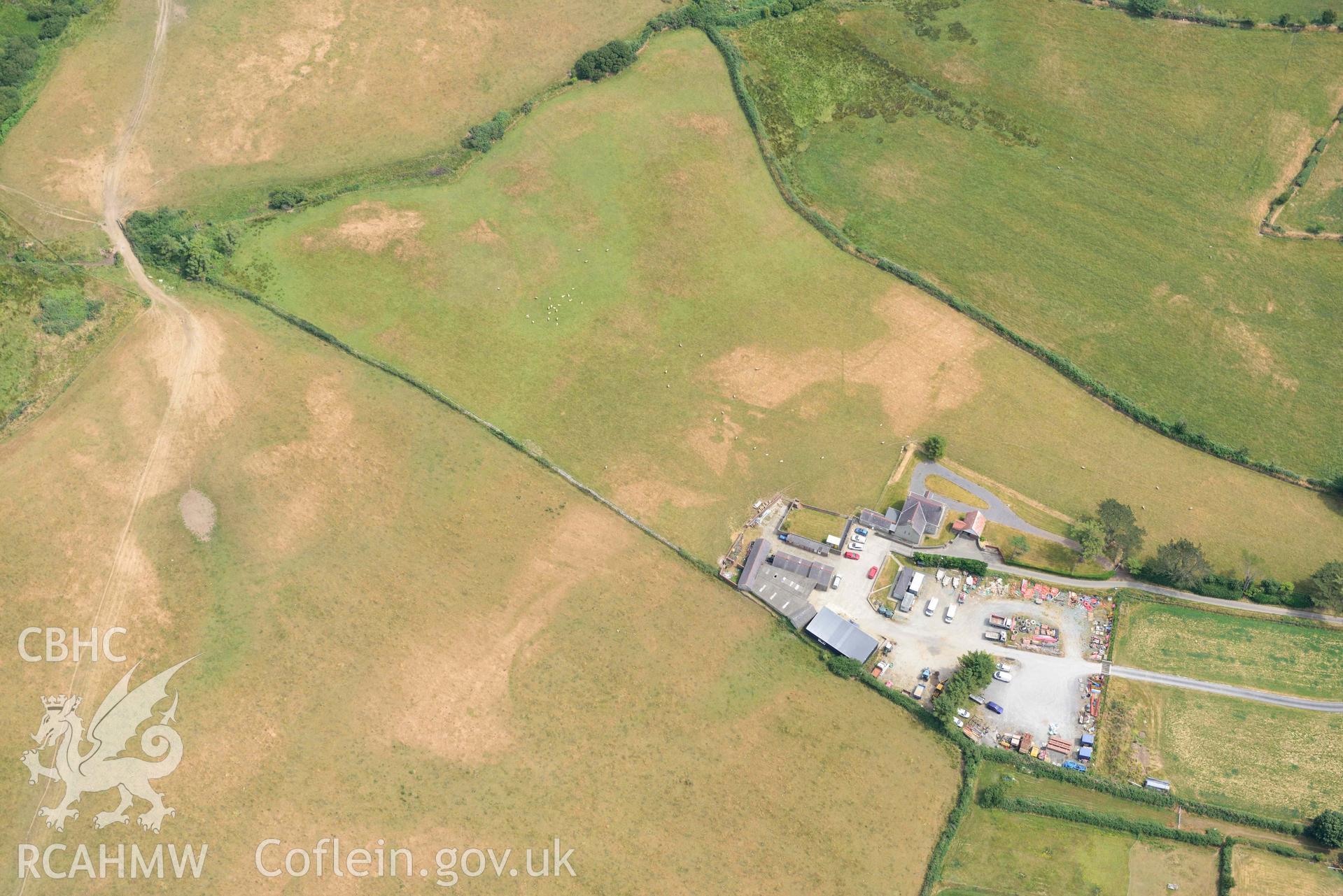 Pwll Parc cropmark enclosure west of Morfa Nefyn. Oblique aerial photograph taken during the Royal Commission’s programme of archaeological aerial reconnaissance by Toby Driver on 10 July 2018.