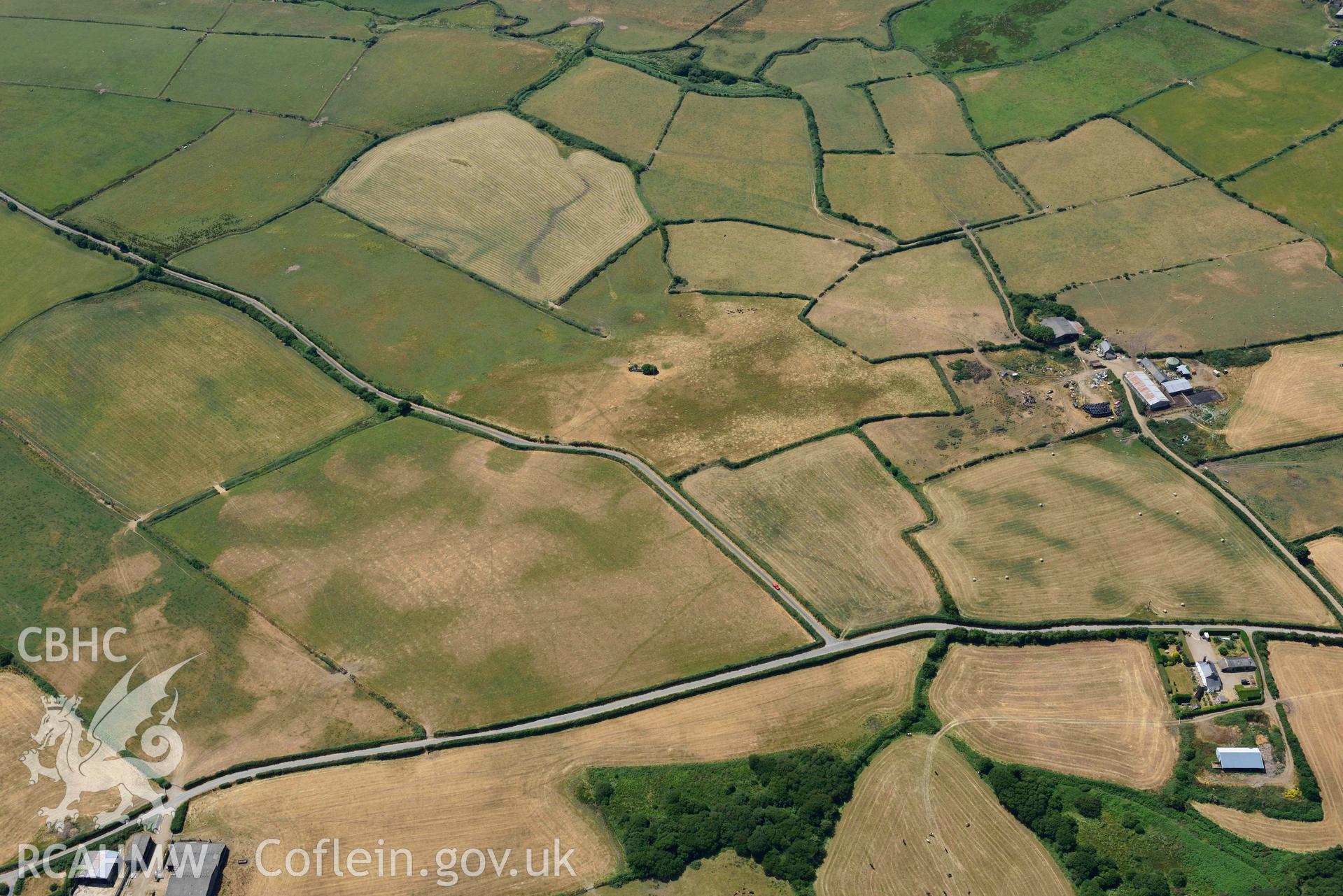 Baroch fawr cropmark enclosure. Oblique aerial photograph taken during the Royal Commission’s programme of archaeological aerial reconnaissance by Toby Driver on 10 July 2018.