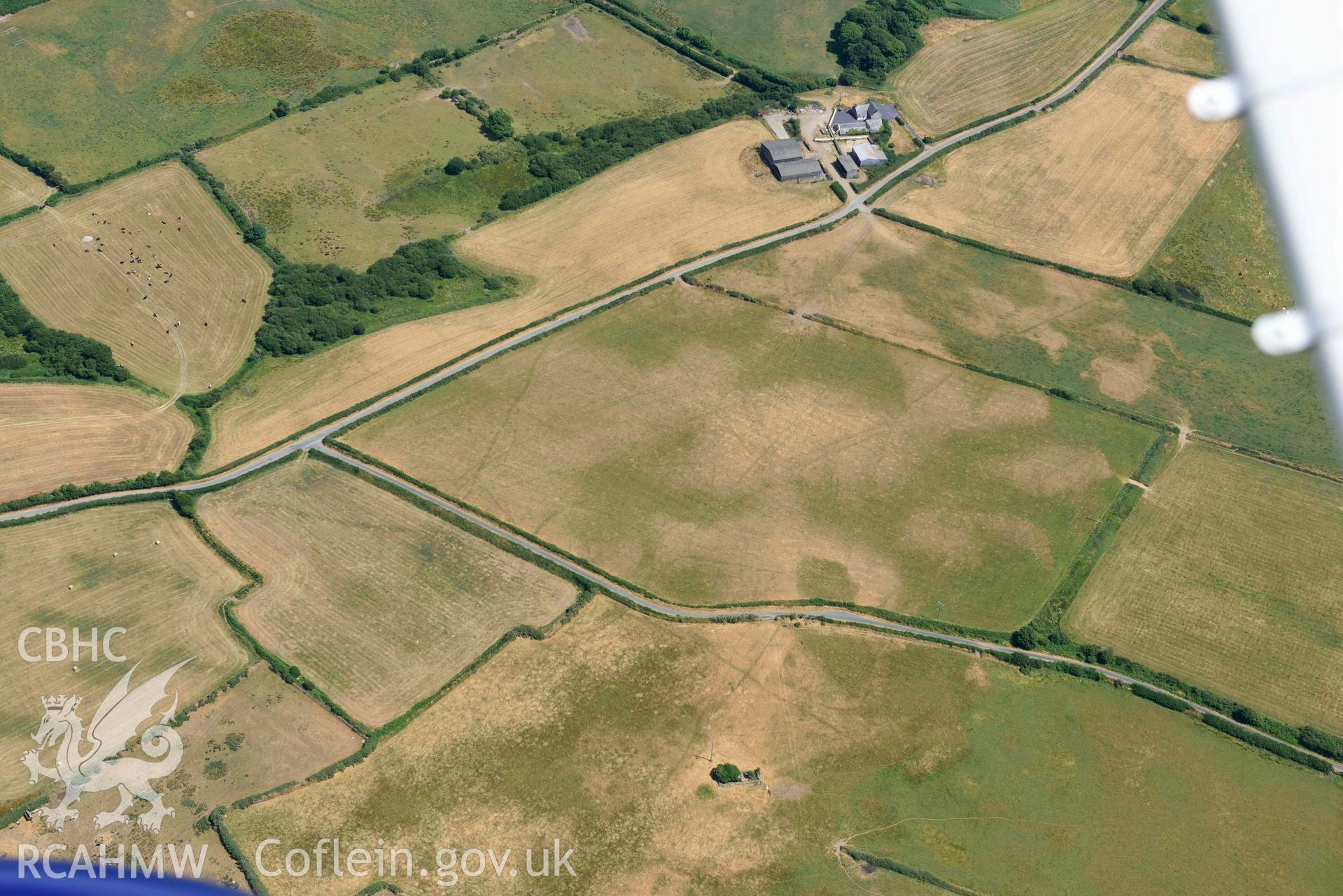 Baroch fawr cropmark enclosure. Oblique aerial photograph taken during the Royal Commission’s programme of archaeological aerial reconnaissance by Toby Driver on 10 July 2018.