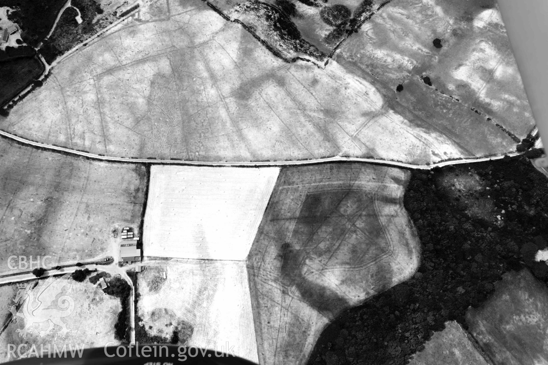 Pen Bryn Adda field system. Oblique black and white aerial photograph taken during the Royal Commission’s programme of archaeological aerial reconnaissance by Toby Driver on 10 July 2018.