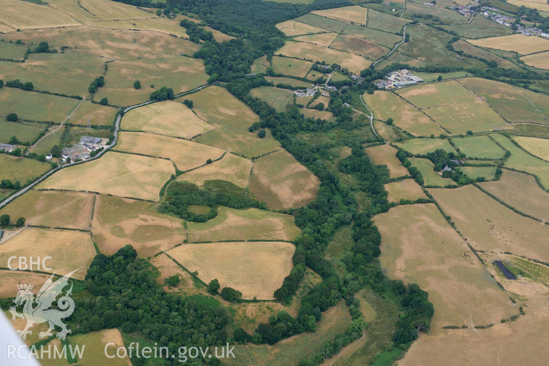 Bwlch y Ffordd Isa defended enclosure and surrounding landscape. Oblique aerial photograph taken during the Royal Commission’s programme of archaeological aerial reconnaissance by Toby Driver on 10 July 2018.