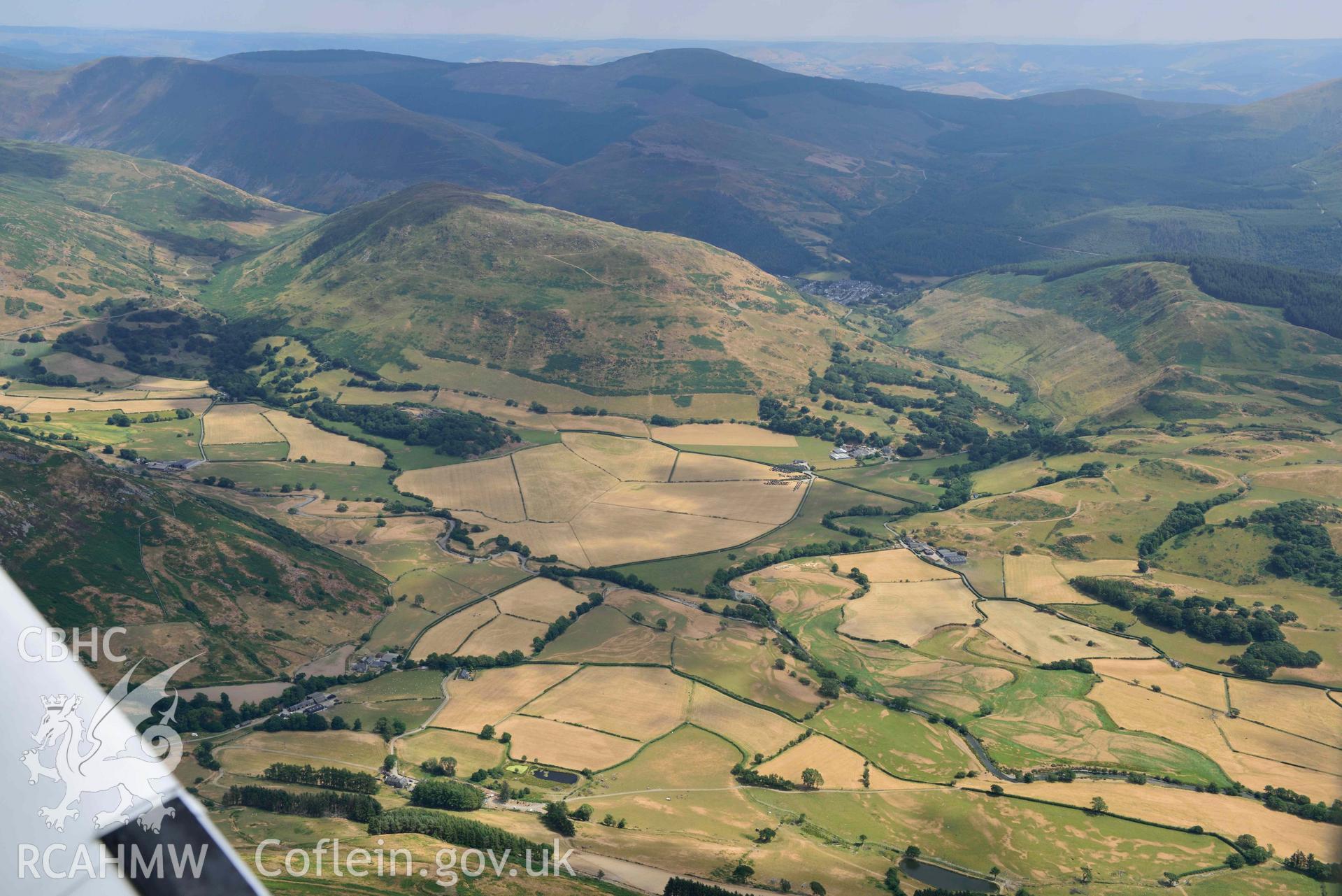 Landscape around Dyffryn Dysynni defended enclosure and Castell y Bere. Oblique aerial photograph taken during the Royal Commission’s programme of archaeological aerial reconnaissance by Toby Driver on 10 July 2018.