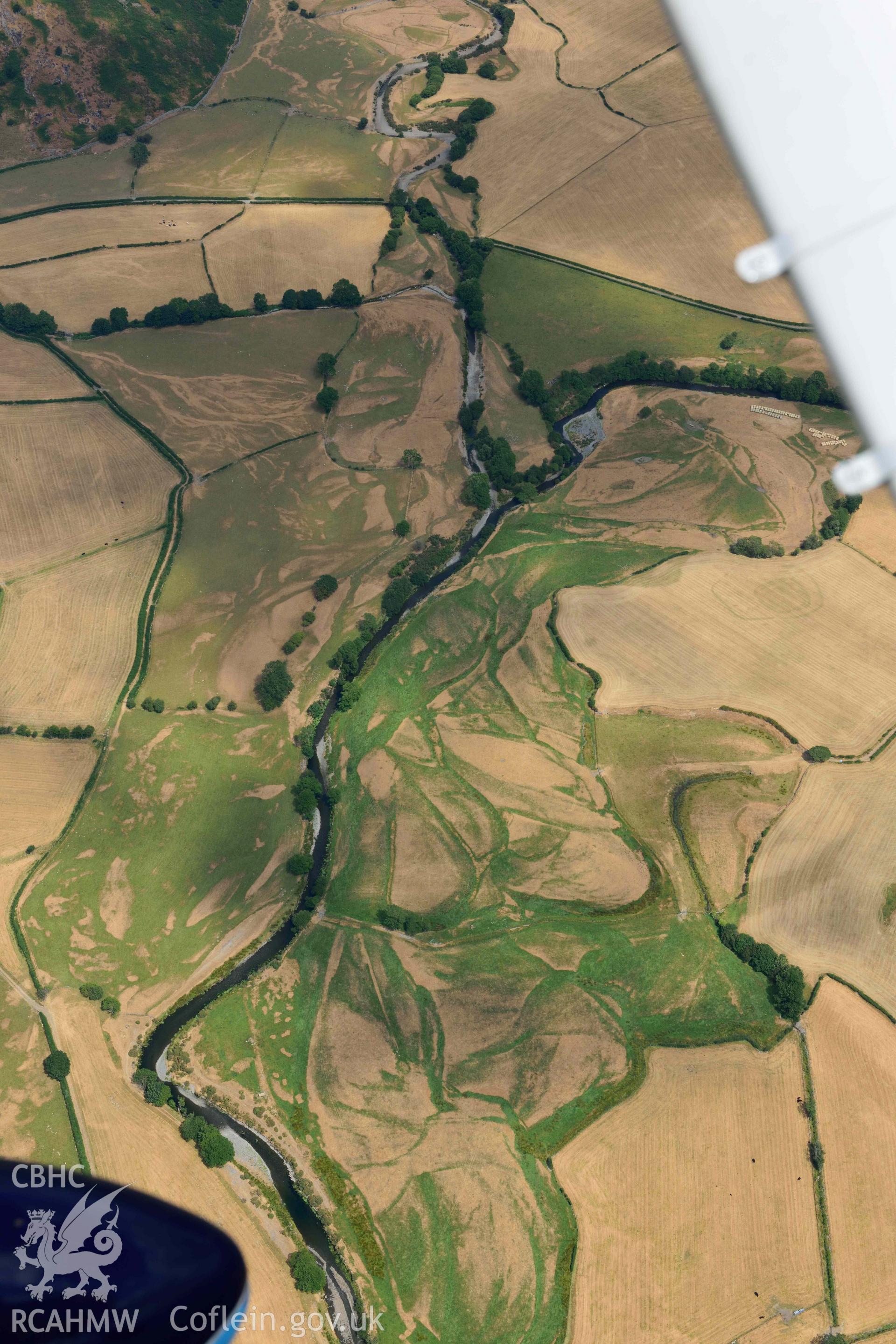 Dyffryn Dysynni defended enclosure. Oblique aerial photograph taken during the Royal Commission’s programme of archaeological aerial reconnaissance by Toby Driver on 10 July 2018.