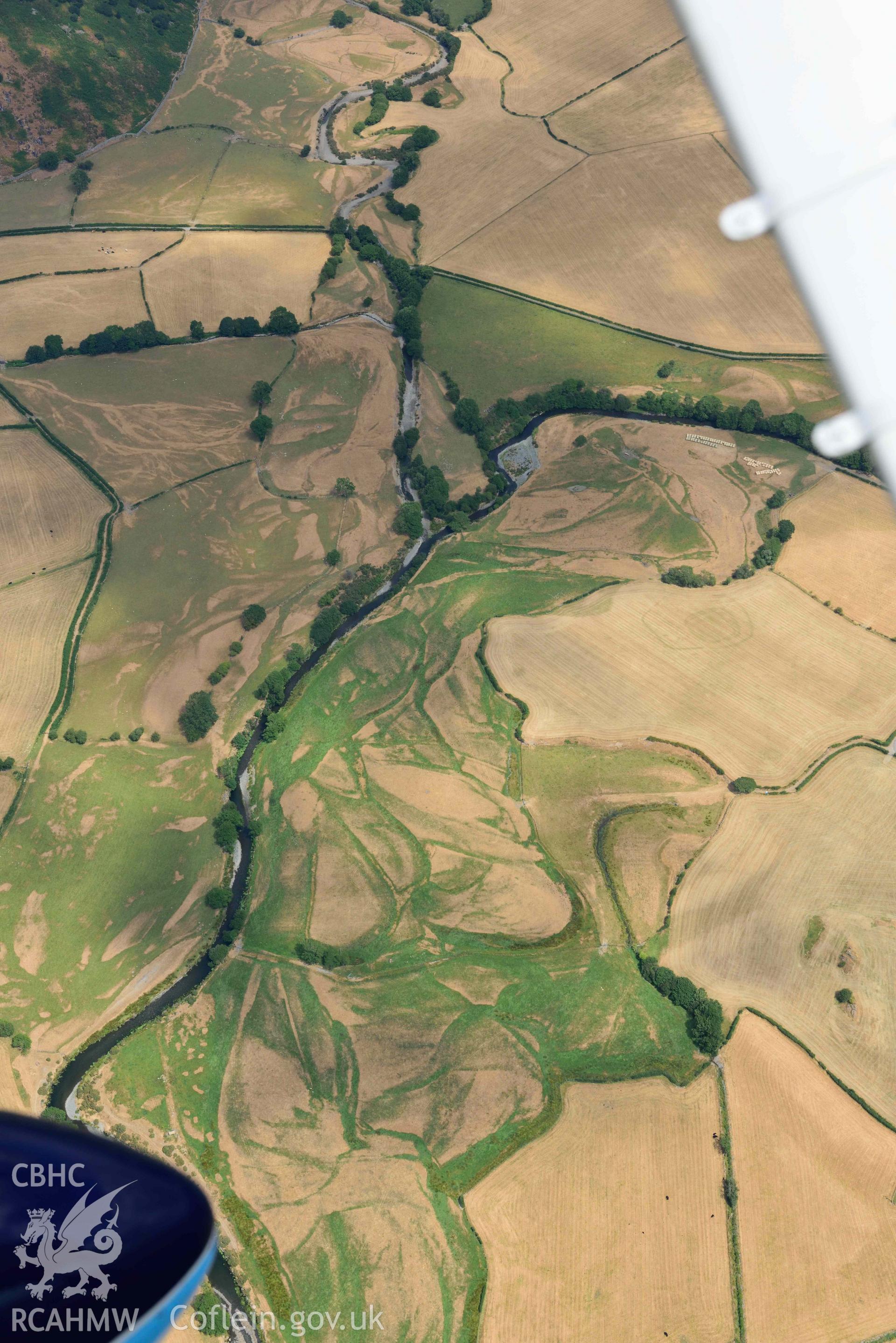 Dyffryn Dysynni defended enclosure. Oblique aerial photograph taken during the Royal Commission’s programme of archaeological aerial reconnaissance by Toby Driver on 10 July 2018.