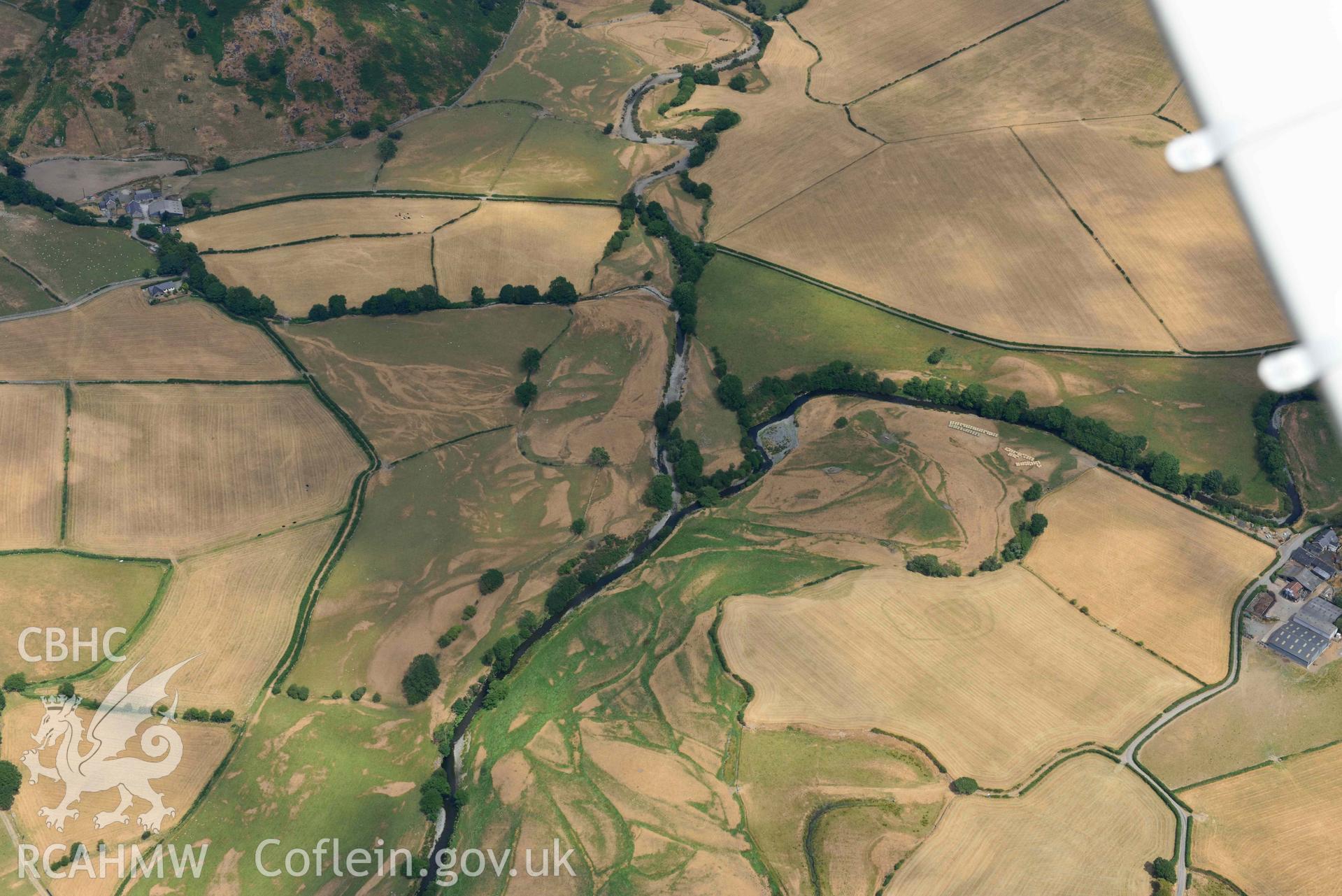 General view of Dyffryn Dysynni defended enclosure. Oblique aerial photograph taken during the Royal Commission’s programme of archaeological aerial reconnaissance by Toby Driver on 10 July 2018.