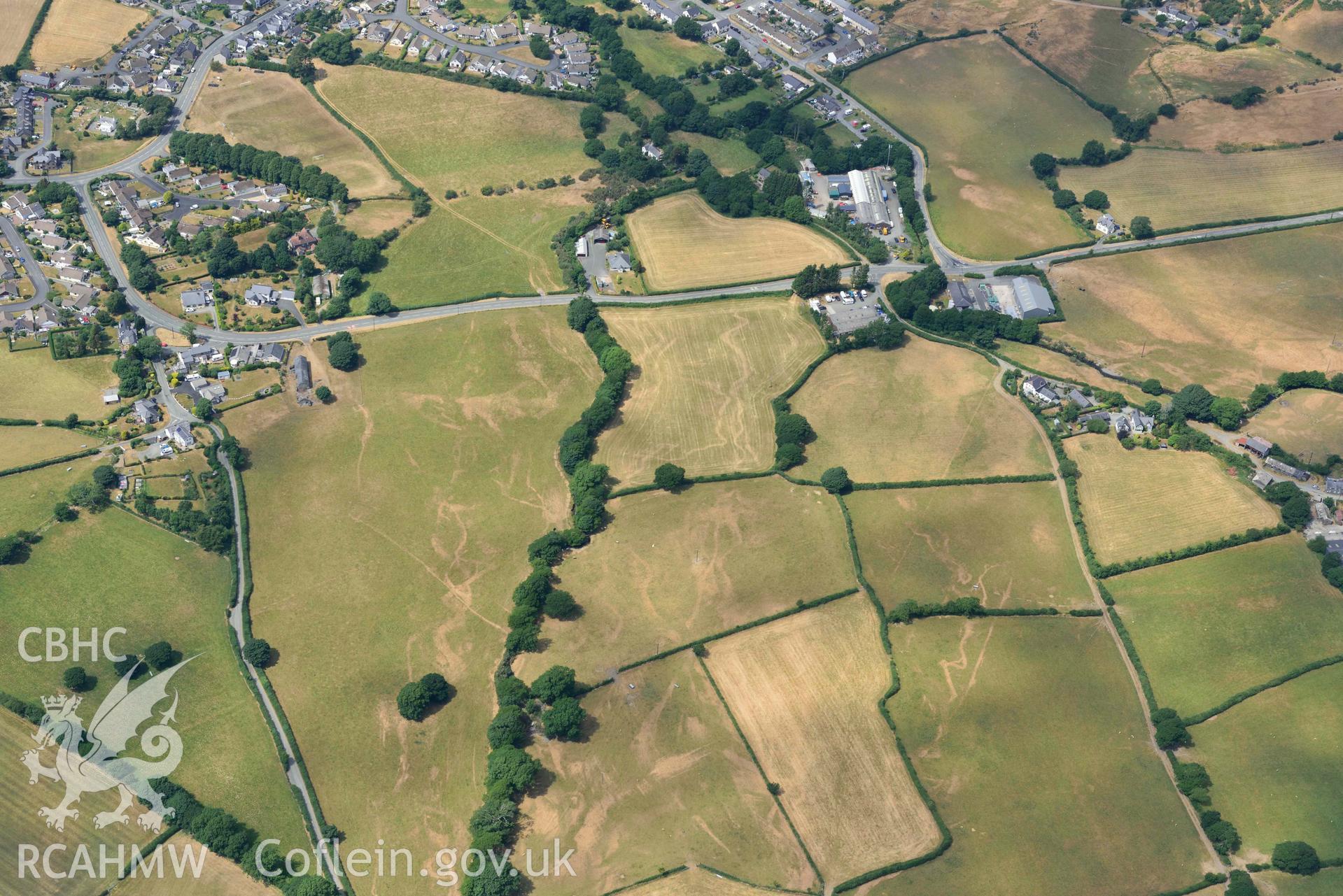 General view of Bryncrug Pont y Felindre cropmarks. Oblique aerial photograph taken during the Royal Commission’s programme of archaeological aerial reconnaissance by Toby Driver on 10 July 2018.