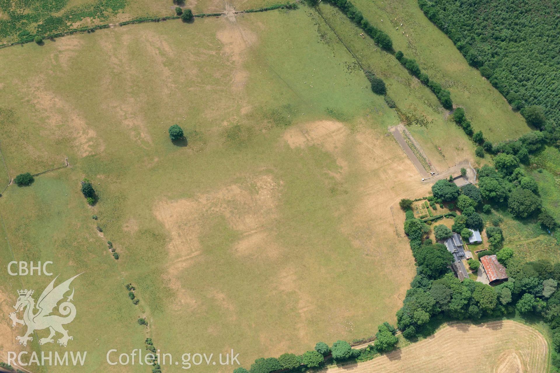 Traian bivallate cropmark enclosure. Oblique aerial photograph taken during the Royal Commission’s programme of archaeological aerial reconnaissance by Toby Driver on 10 July 2018.