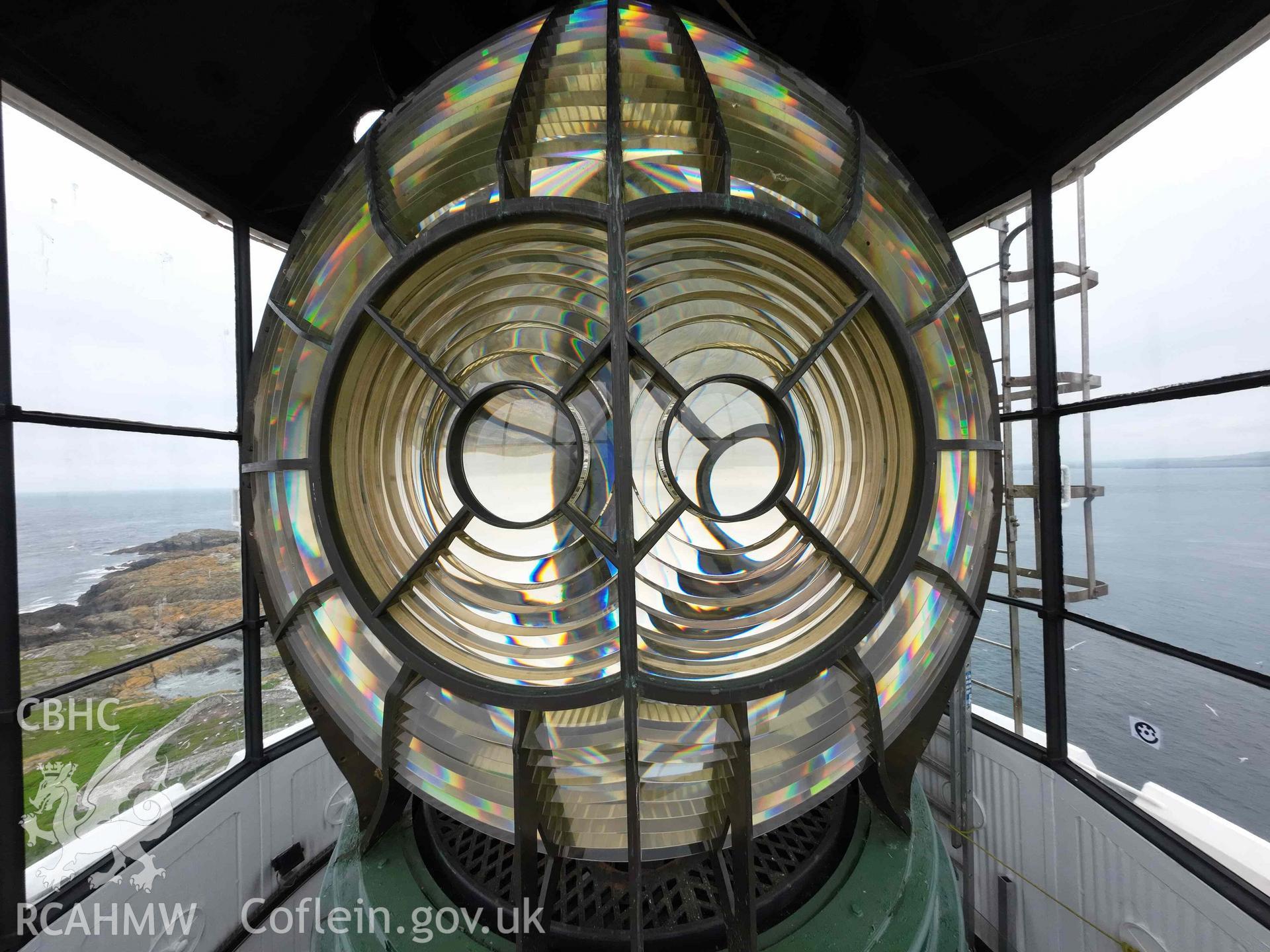 Wide-angle view, at the level of the focal plane, of one face of the Fresnel lens within the Skerries Lighthouse lantern room on 16/07/2024.