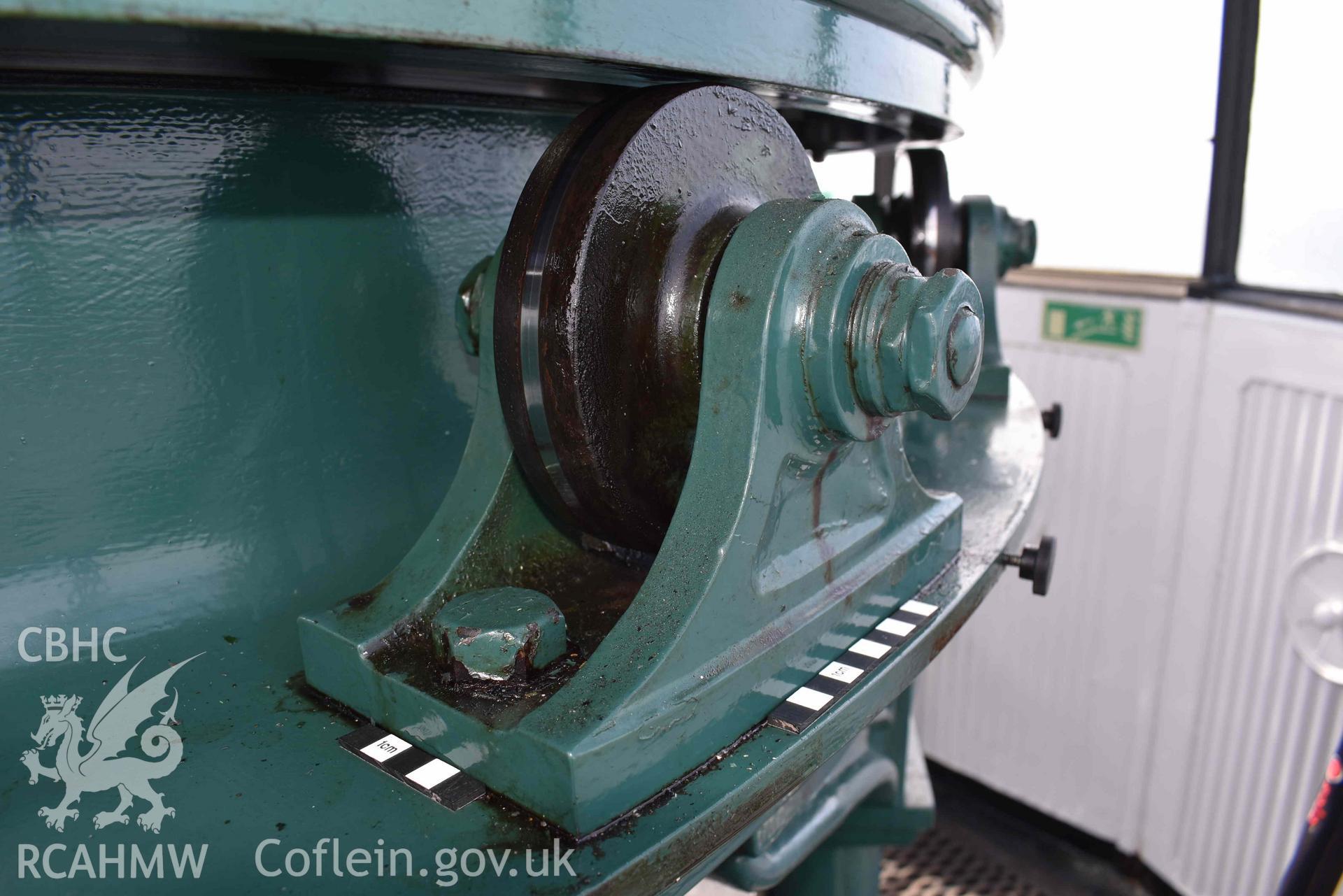 Detail of one of the Skerries Lighthouse lens pedestal's supporting wheels on 16/07/2024. Scale is 10cm and 5cm.