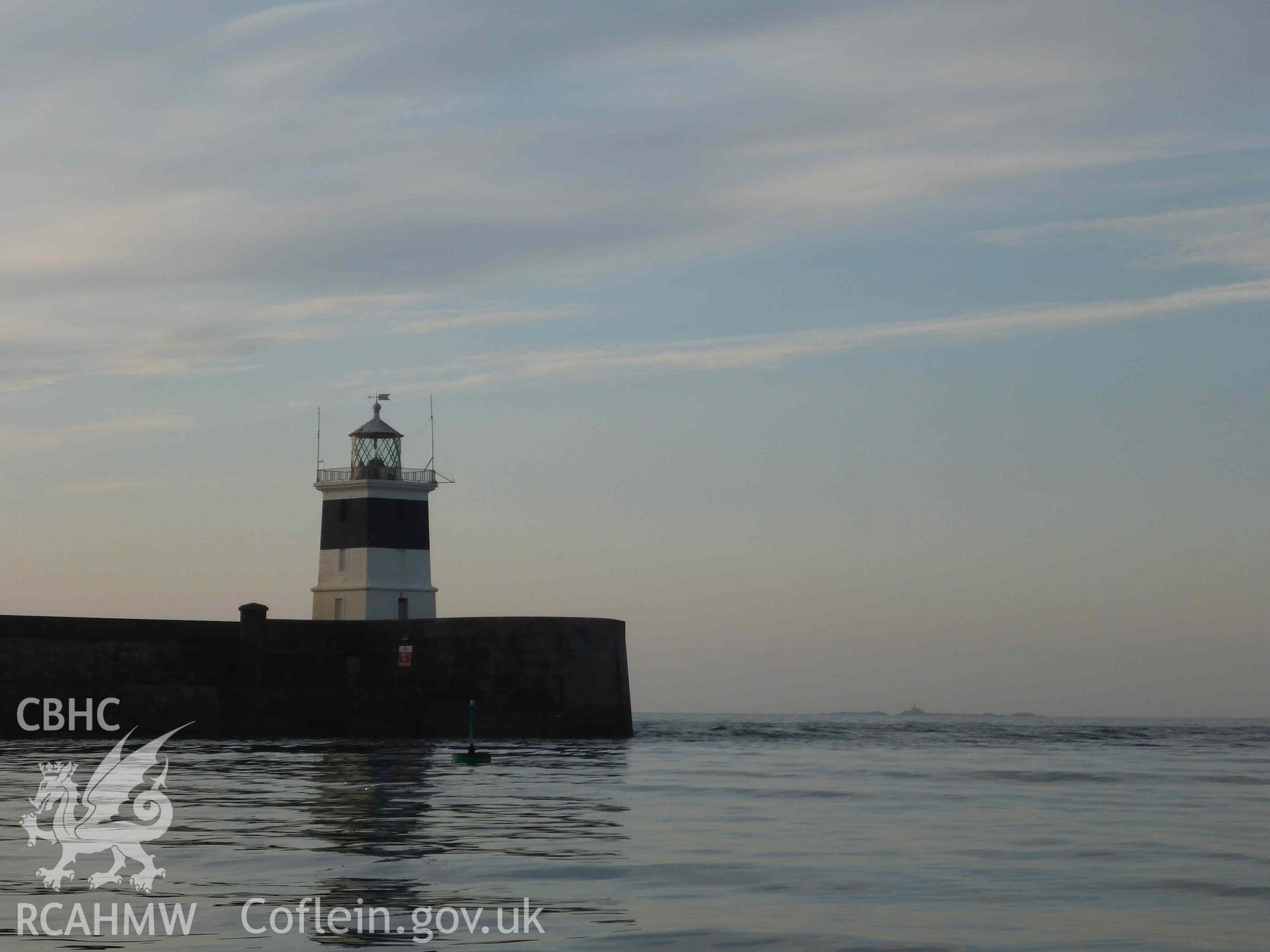 Holyhead Breakwater Lighthouse viewed from the south on 16/07/2024. The Skerries Lighthouse is visible on the horizon.