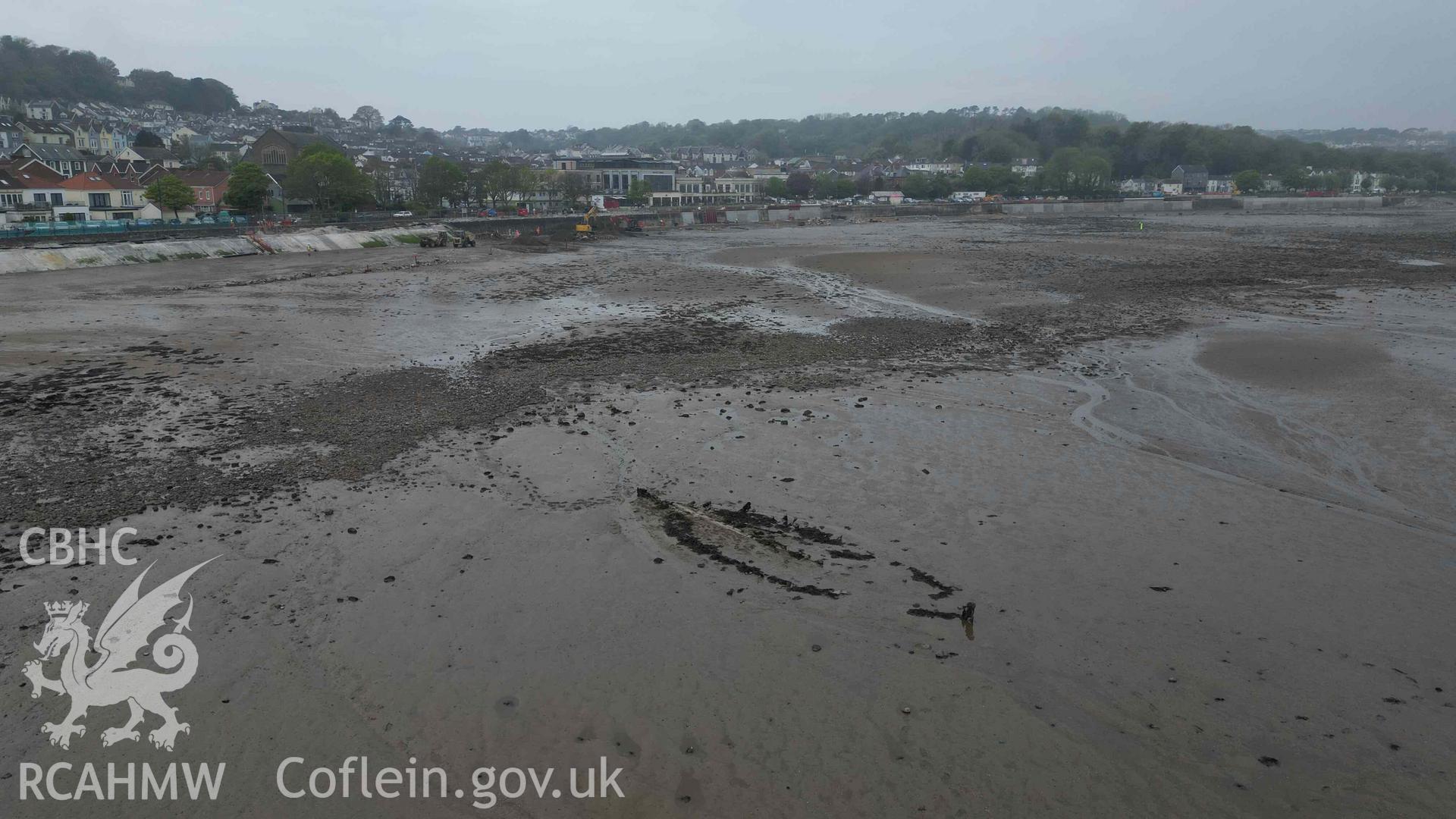 General oblique view of Mumbles Wreck 1, looking west, on 08/05/2024. Ongoing sea defence work can be seen in the background.