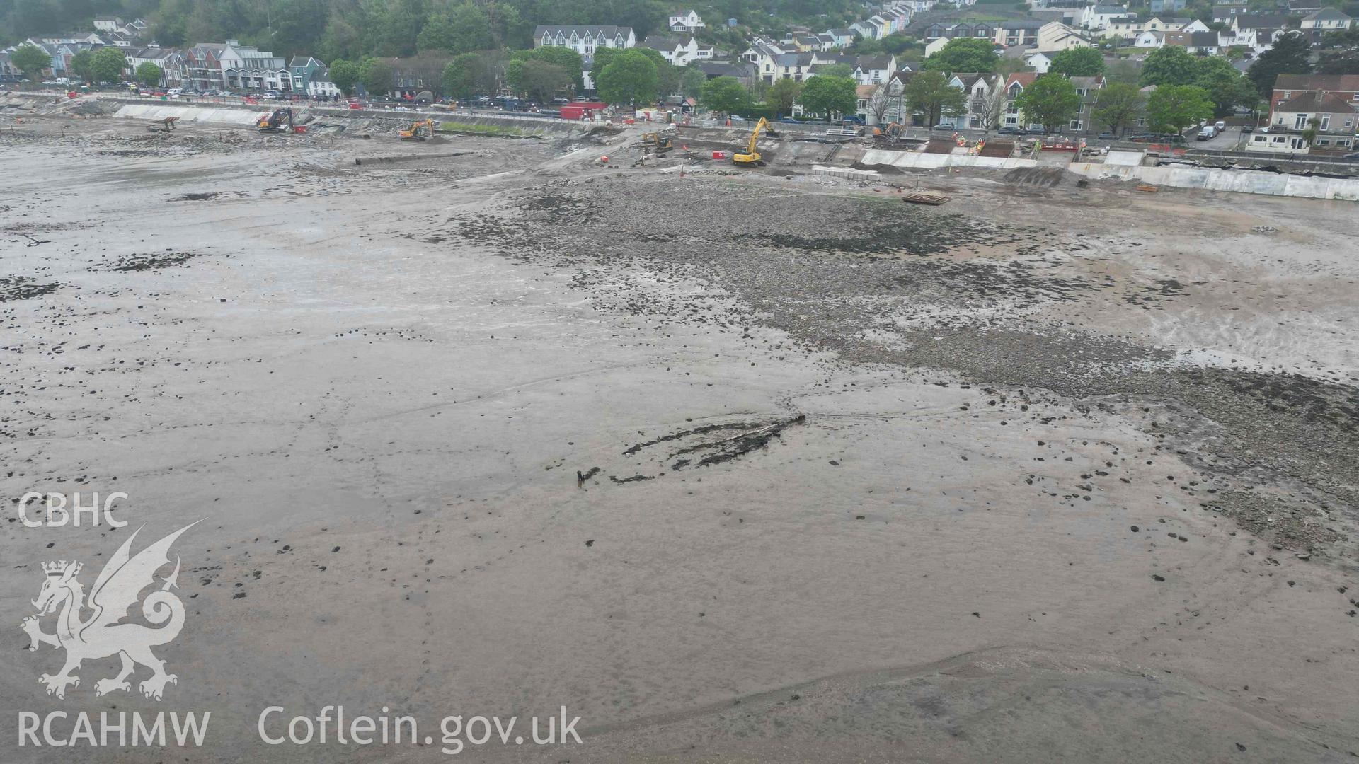 General oblique view of Mumbles Wreck 1, looking south, on 08/05/2024. Ongoing sea defence work can be seen in the background.