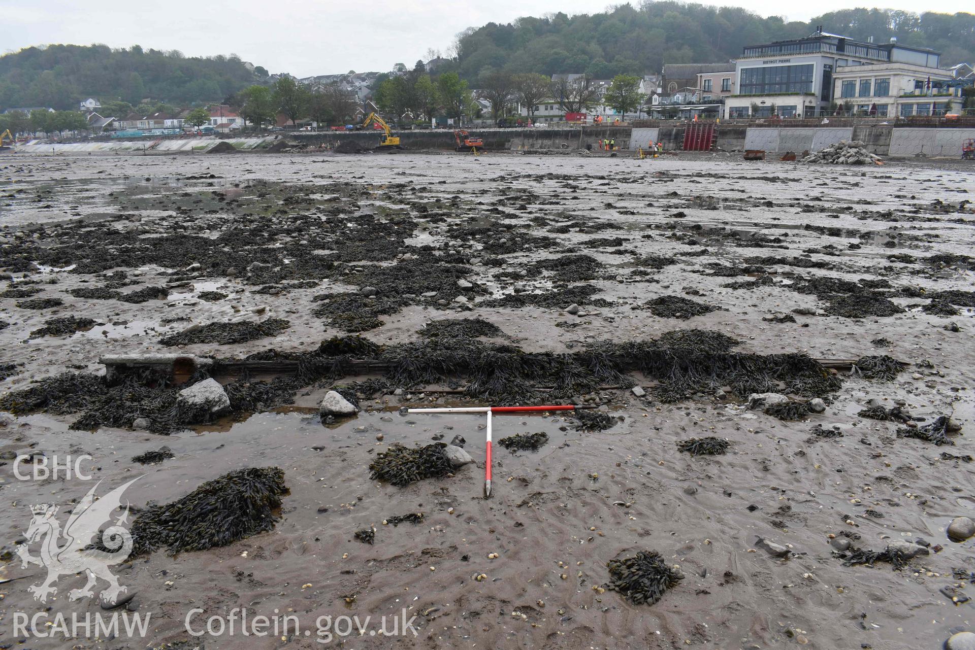 Mumbles Wreck 5, looking south, on 08/05/2024. Scales are 1m. Ongoing sea defence works are visible in the background.