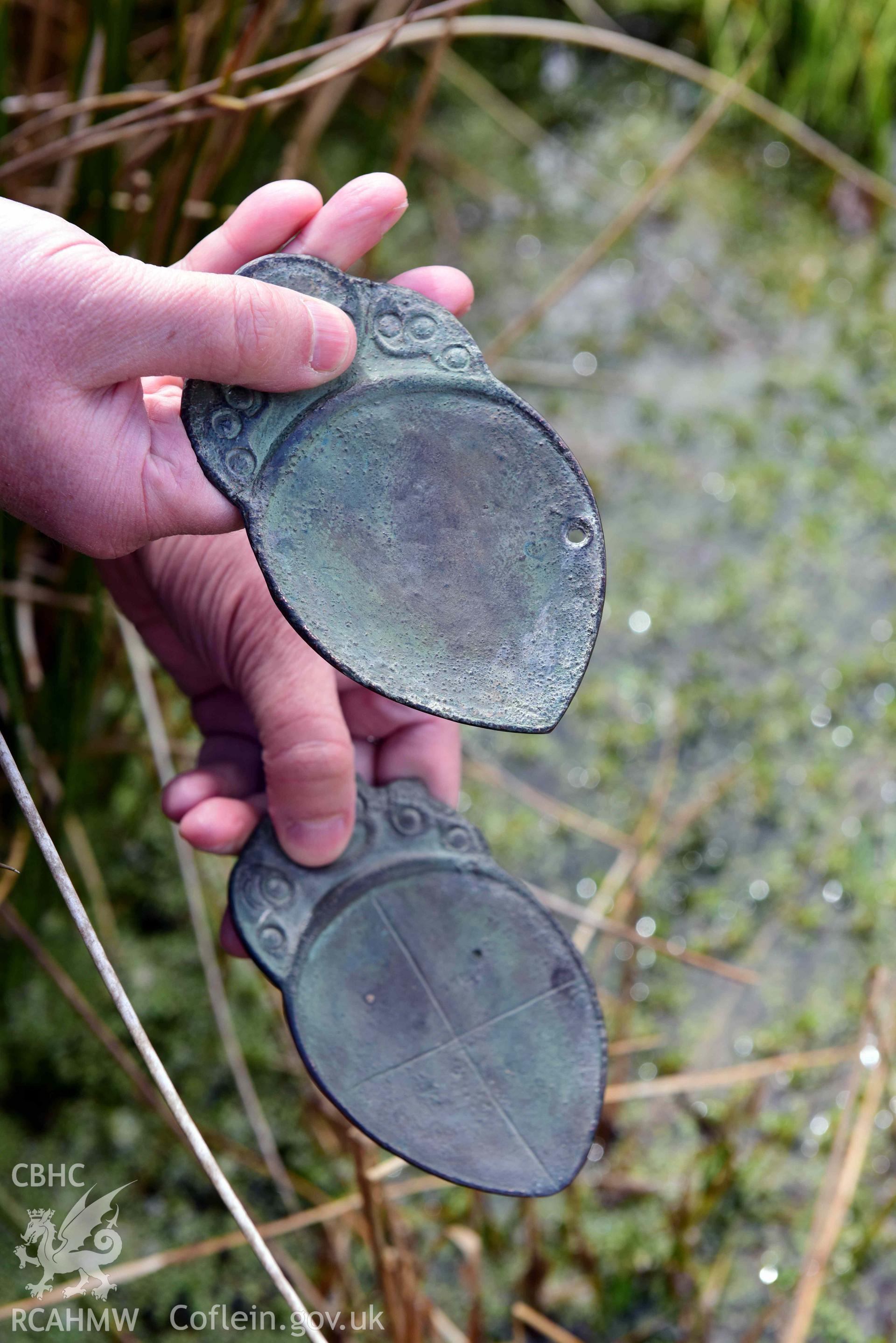 Electrotype replicas of the Penbryn Spoons, loaned from Amgueddfa Ceredigion Museum, photographed outdoors to show their imagined use at a sacred spring