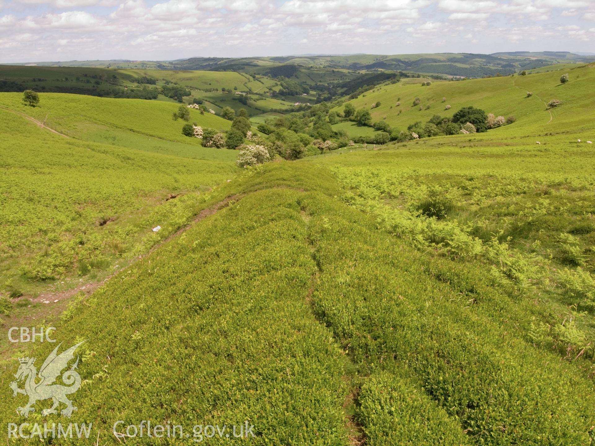 view looking NE of NE end and looking down into stream valley.