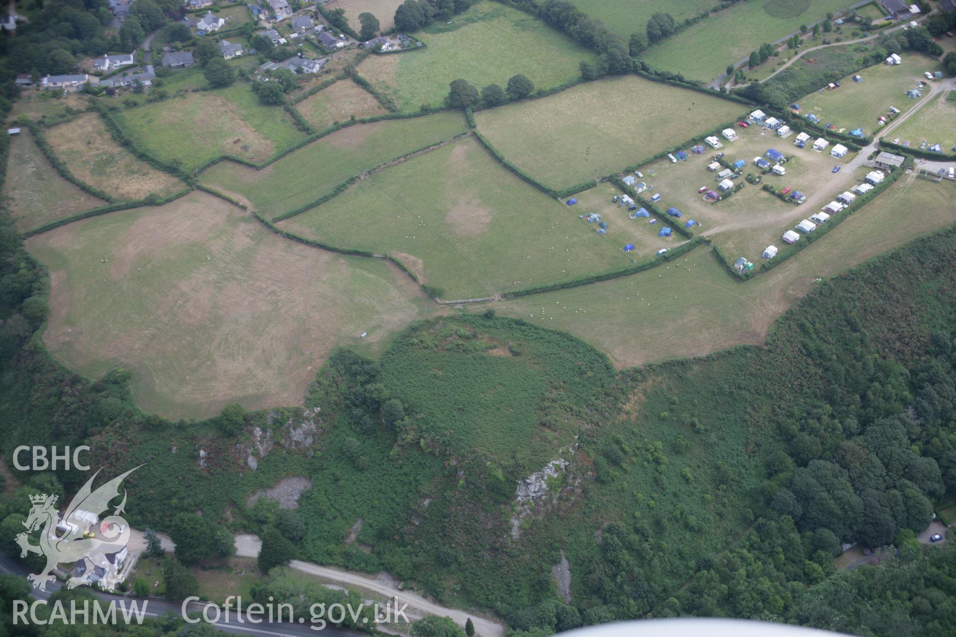 RCAHMW colour oblique aerial photograph of Pen-y-Gaer Hillfort Enclosure, viewed from the west. Taken on 03 August 2006 by Toby Driver.