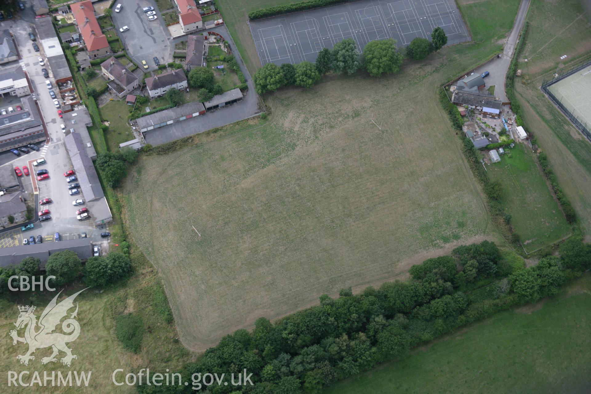 RCAHMW colour oblique aerial photograph of H.M. Stanley Hospital and Chapel showing possible parchmarks of a linear feature, perhaps a road. Taken on 14 August 2006 by Toby Driver.