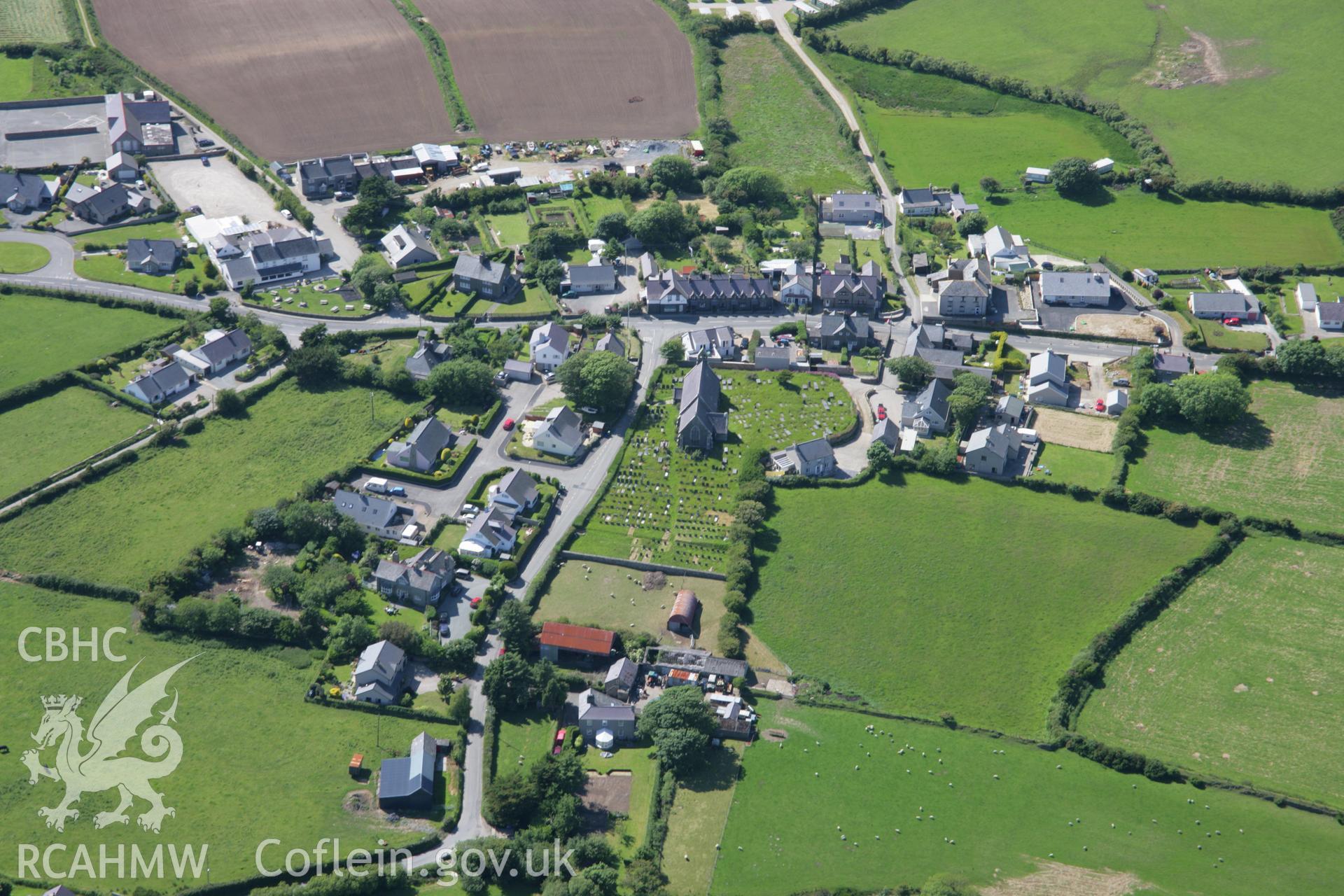 RCAHMW colour oblique aerial photograph of St Curyfan's Church, from the south-east. Taken on 14 June 2006 by Toby Driver.