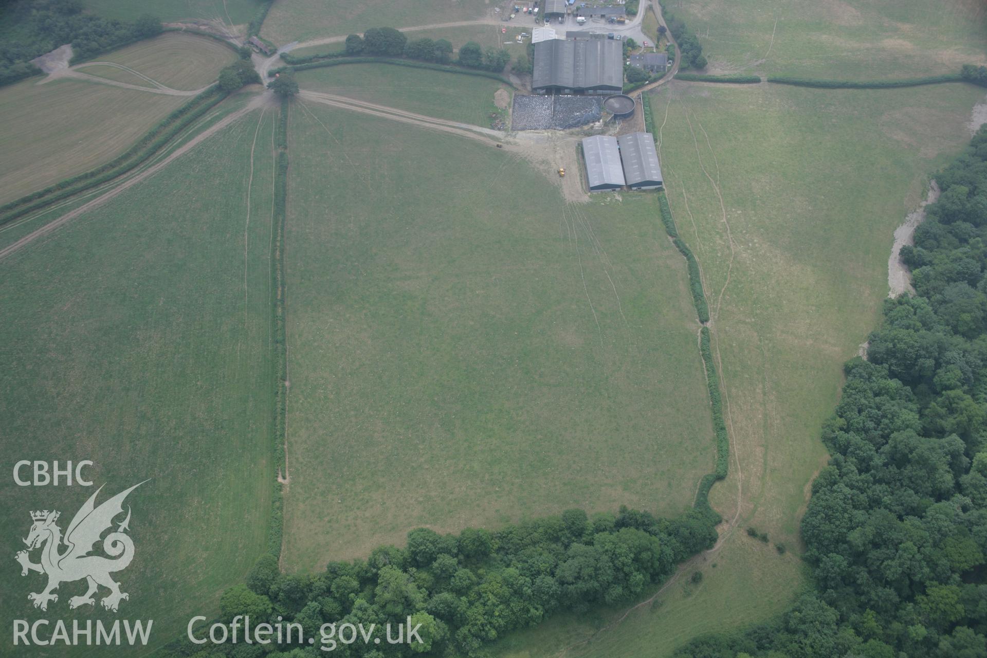 RCAHMW colour oblique aerial photograph of enclosure, Henllan Farm I. Taken on 21 July 2006 by Toby Driver.