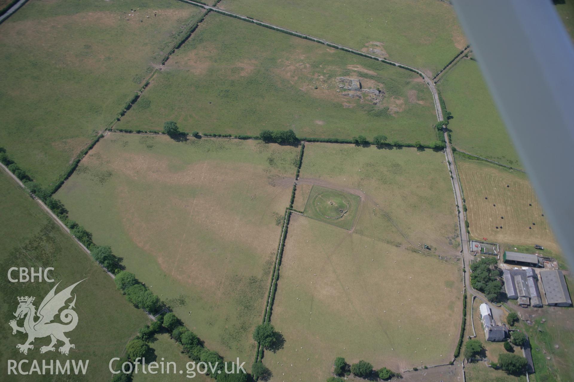 RCAHMW colour oblique aerial photograph of Bryn Celli Ddu Chambered Tomb. Taken on 25 July 2006 by Toby Driver.