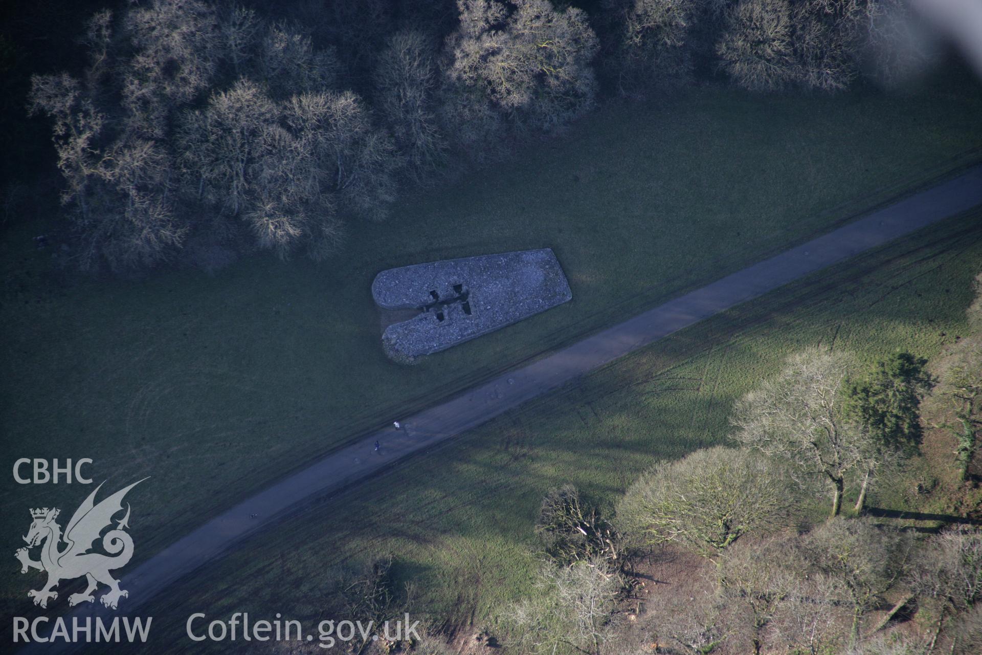 RCAHMW colour oblique aerial photograph of Parc Le Breos Burial Chamber, chambered cairn, viewed from the east. Taken on 26 January 2006 by Toby Driver.