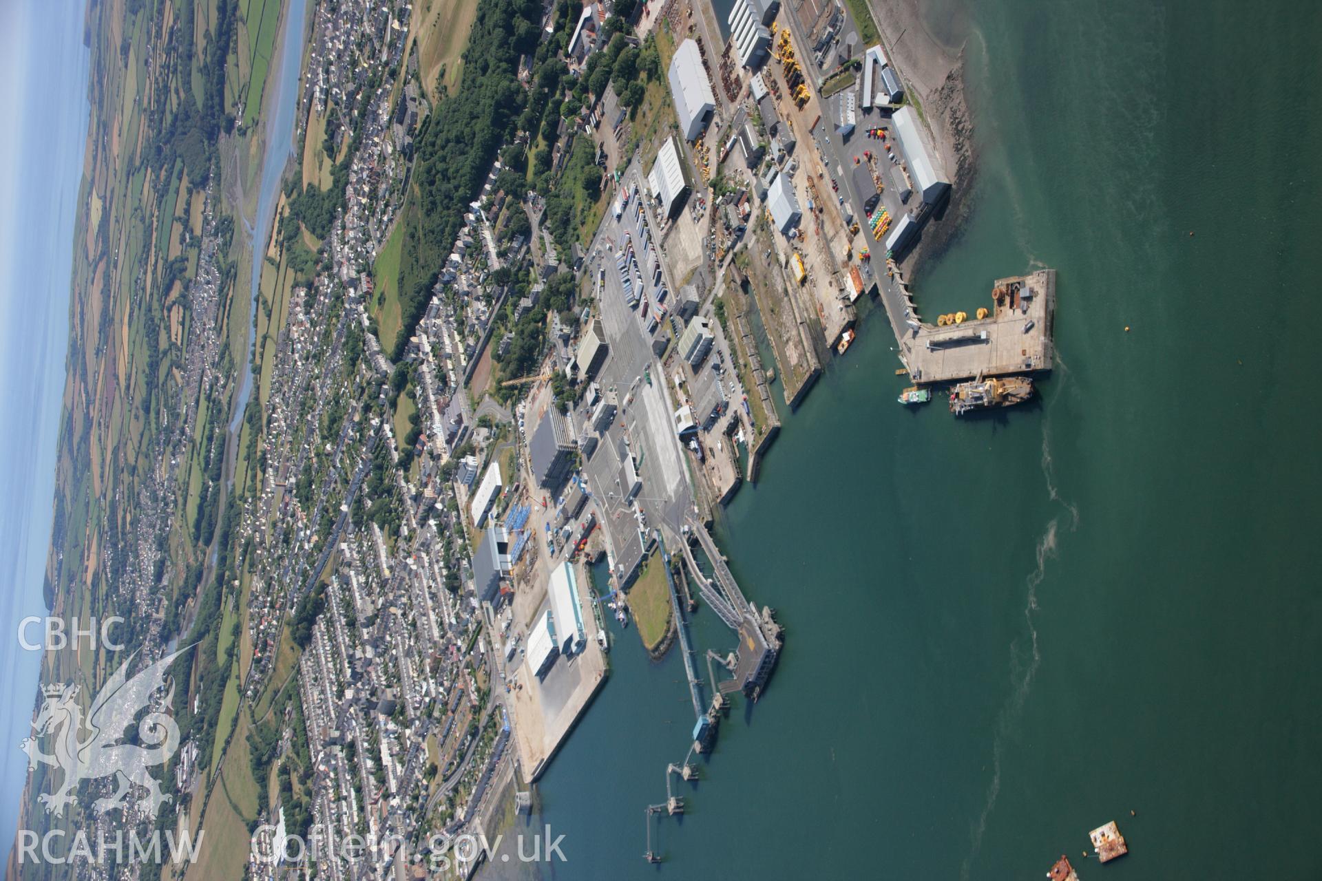 RCAHMW colour oblique aerial photograph of Pembroke Dockyard Dry Dock. Taken on 24 July 2006 by Toby Driver.