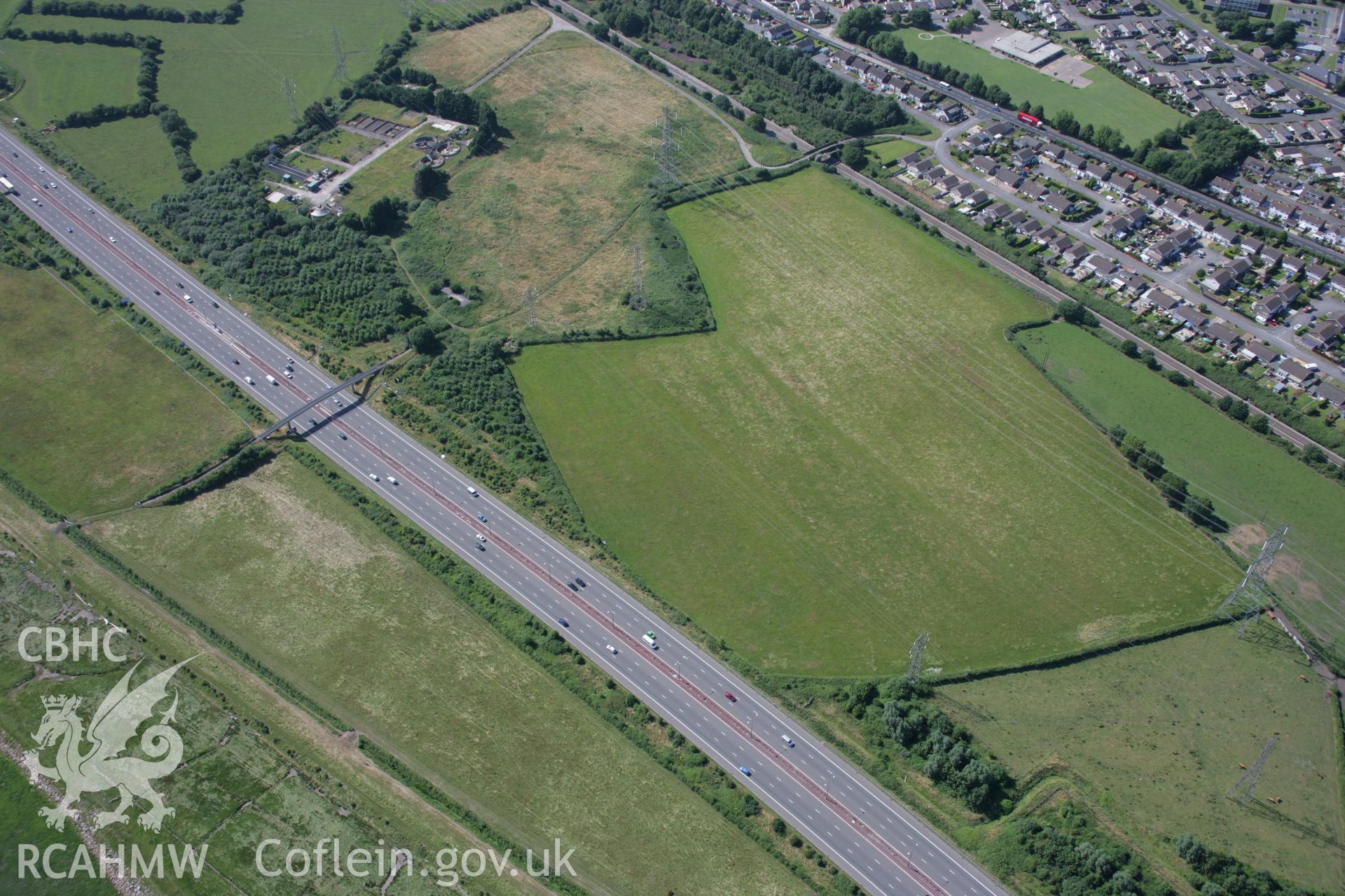 RCAHMW colour oblique aerial photograph of Stoop Hill cropmark enclosure or Roman Villa, Caldicot. Taken on 13 July 2006 by Toby Driver.