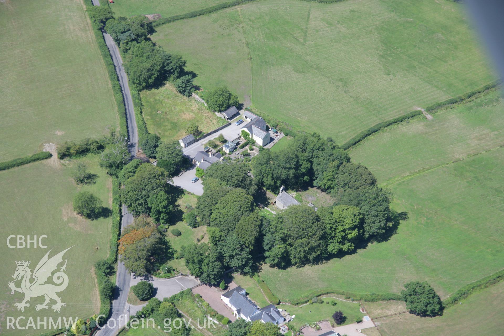 RCAHMW colour oblique aerial photograph of St Canna's Church, Llangan. Taken on 24 July 2006 by Toby Driver.