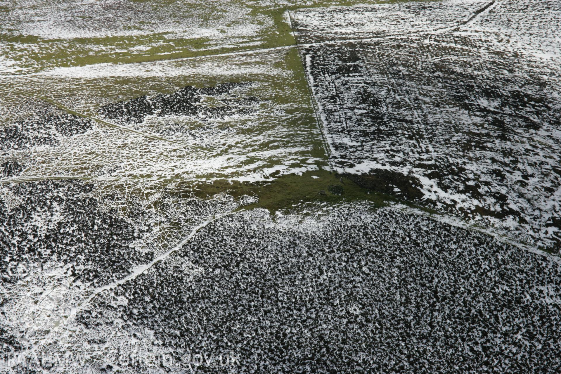 RCAHMW colour oblique aerial photograph of Corndon Hill Barrow II from the north. Taken on 06 March 2006 by Toby Driver.