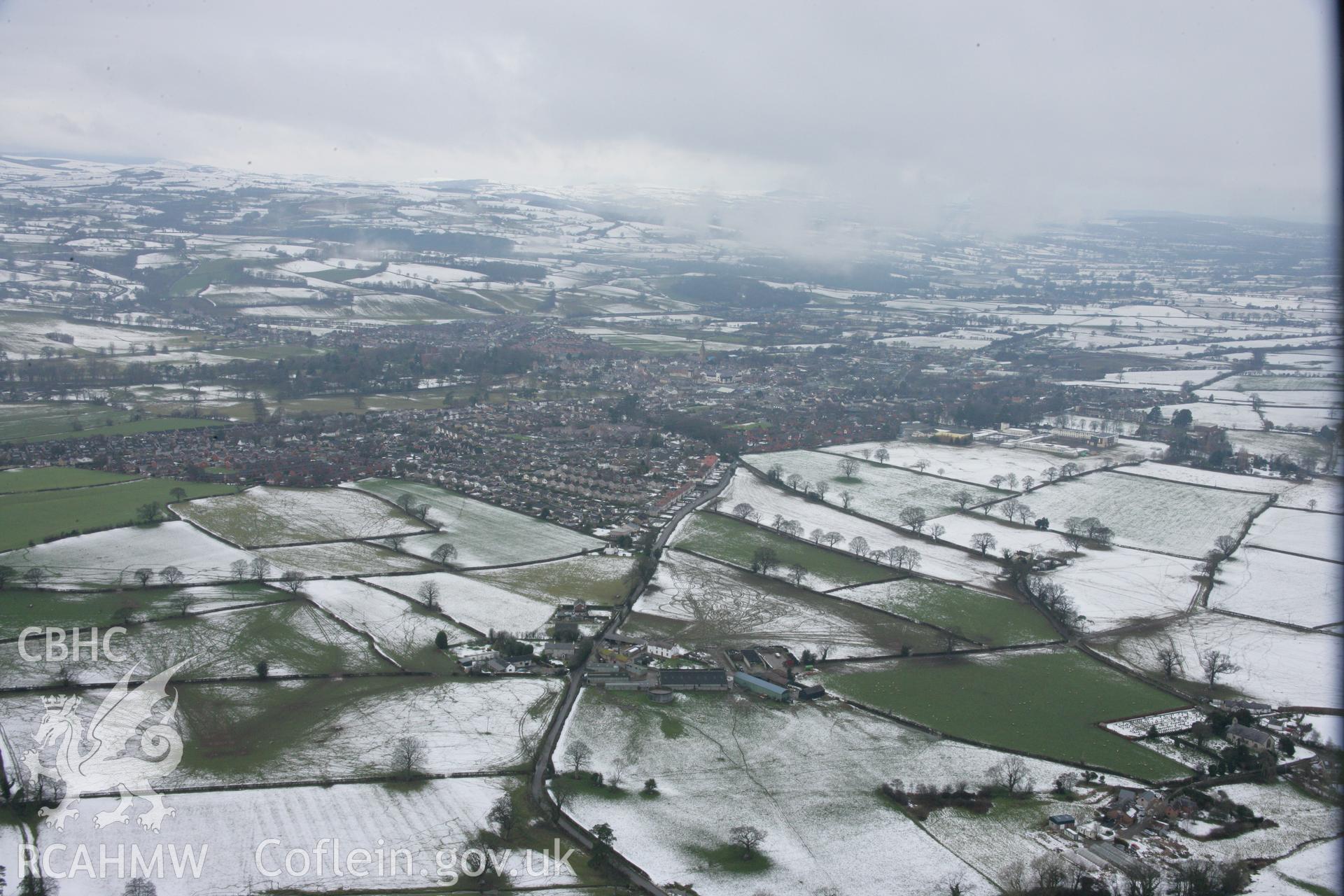 RCAHMW colour oblique aerial photograph of Ruthin. A winter landscape view from the south-east. Taken on 06 March 2006 by Toby Driver.