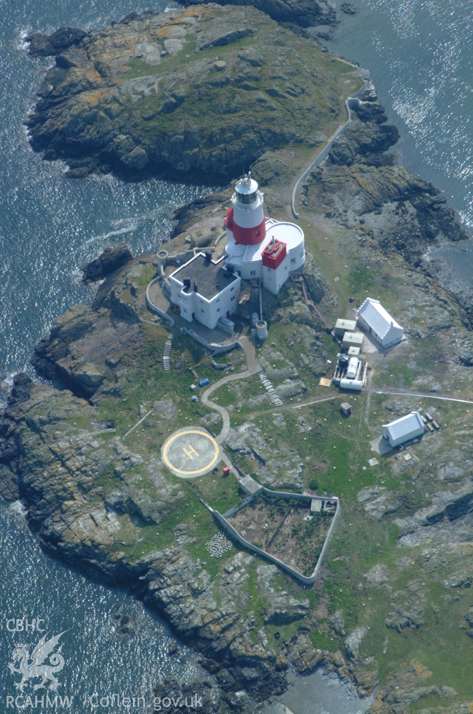RCAHMW colour oblique aerial photograph of the Skerries Lighthouse taken on 26/05/2004 by Toby Driver