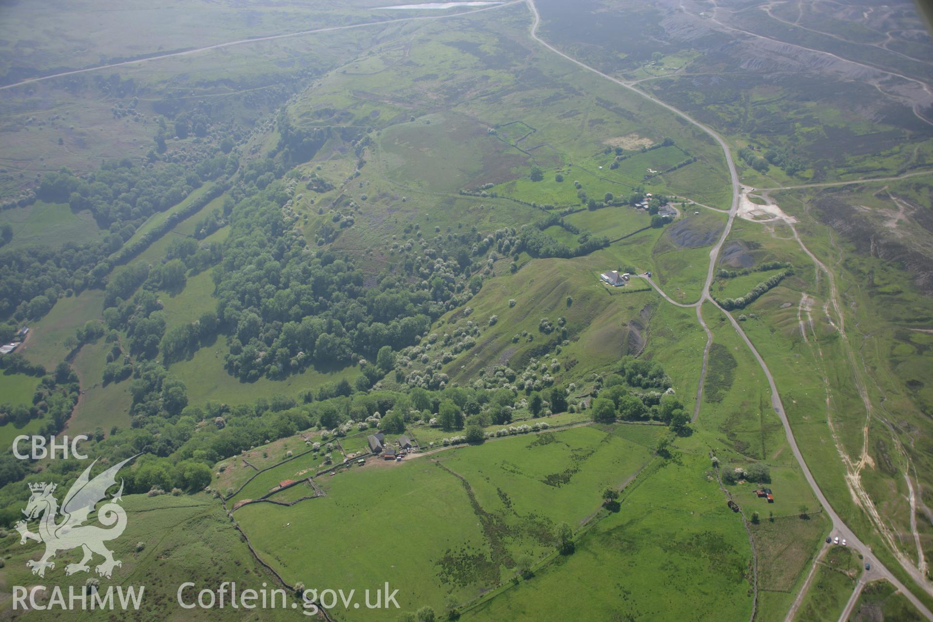 RCAHMW colour oblique aerial photograph of Pwll-Du Limestone Quarries from the north-west. Taken on 09 June 2006 by Toby Driver.