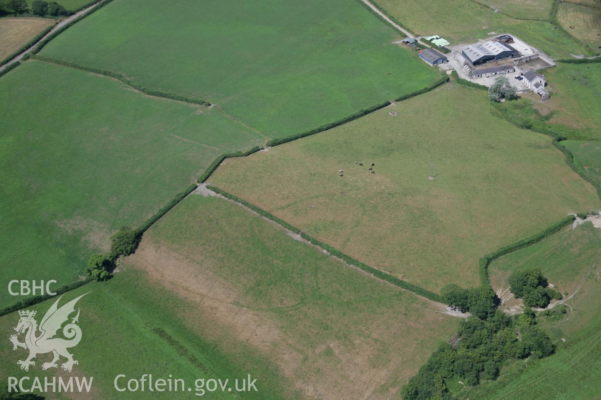 RCAHMW colour oblique aerial photograph of a cropmark enclosure south of Blaen-Lliwe. Taken on 24 July 2006 by Toby Driver.