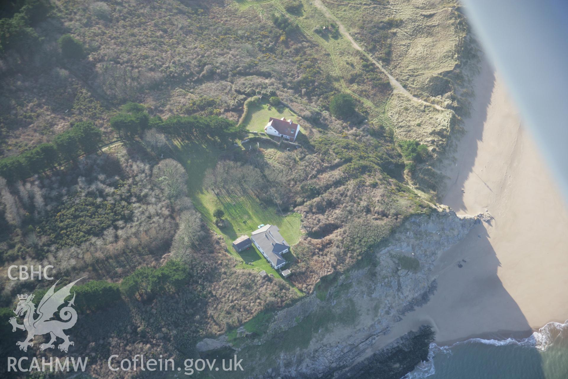 RCAHMW colour oblique aerial photograph of Potter's Cave, Caldy, from the north-east. Taken on 11 January 2006 by Toby Driver.