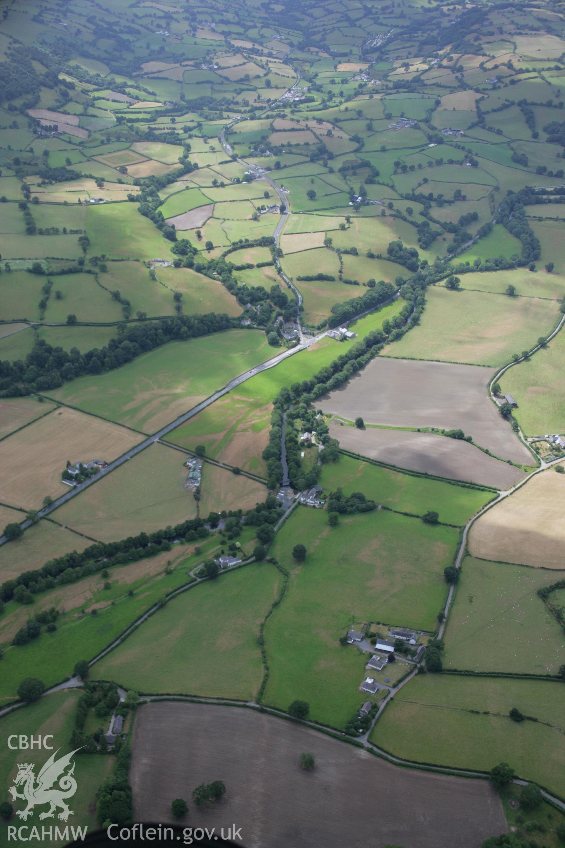 RCAHMW colour oblique aerial photograph of a section of Roman Road from Druid to Pen-y-Bont and Rug. Taken on 31 July 2006 by Toby Driver.