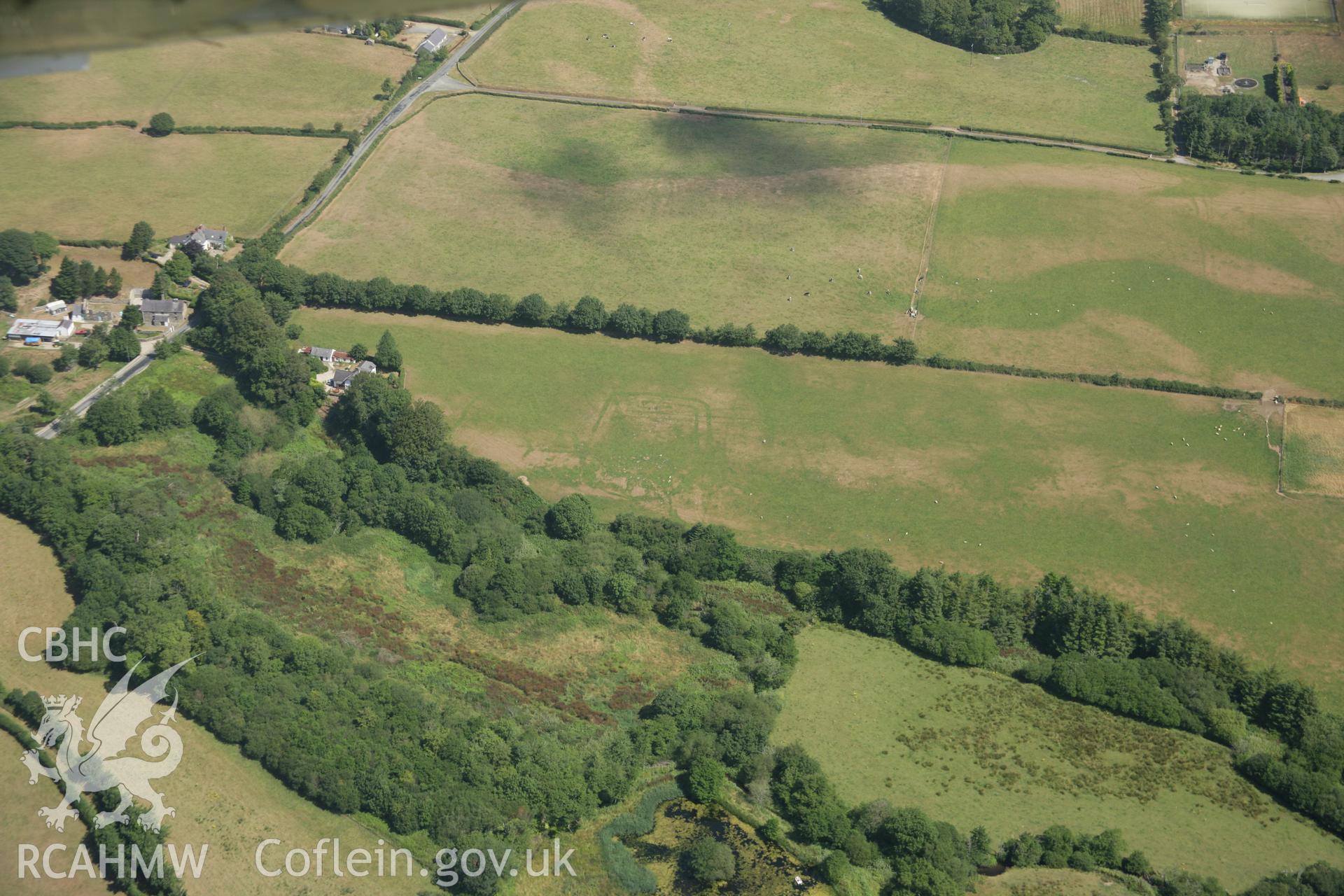 RCAHMW colour oblique aerial photograph of Pont Rhyd-Hir Defended Enclosure, Efailnewydd, from the east. Taken on 03 August 2006 by Toby Driver