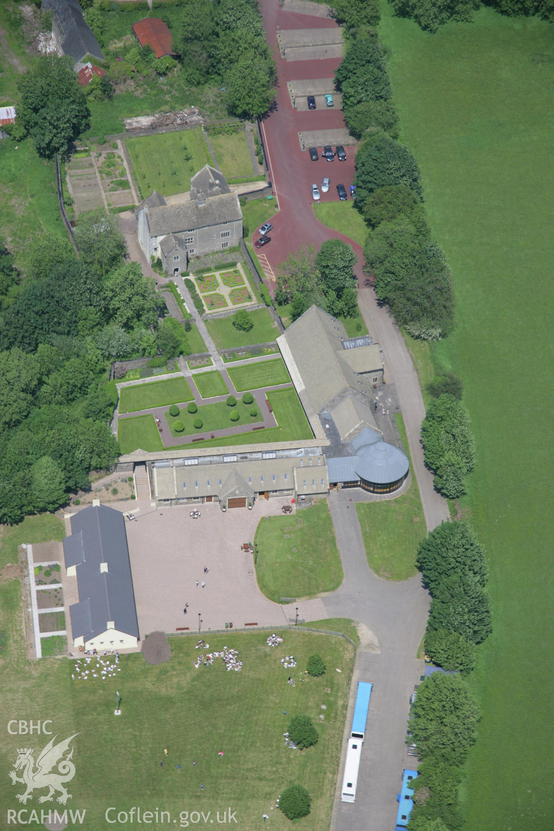 RCAHMW colour oblique aerial photograph of Llancaiach Fawr house, viewed from the south. Taken on 09 June 2006 by Toby Driver.