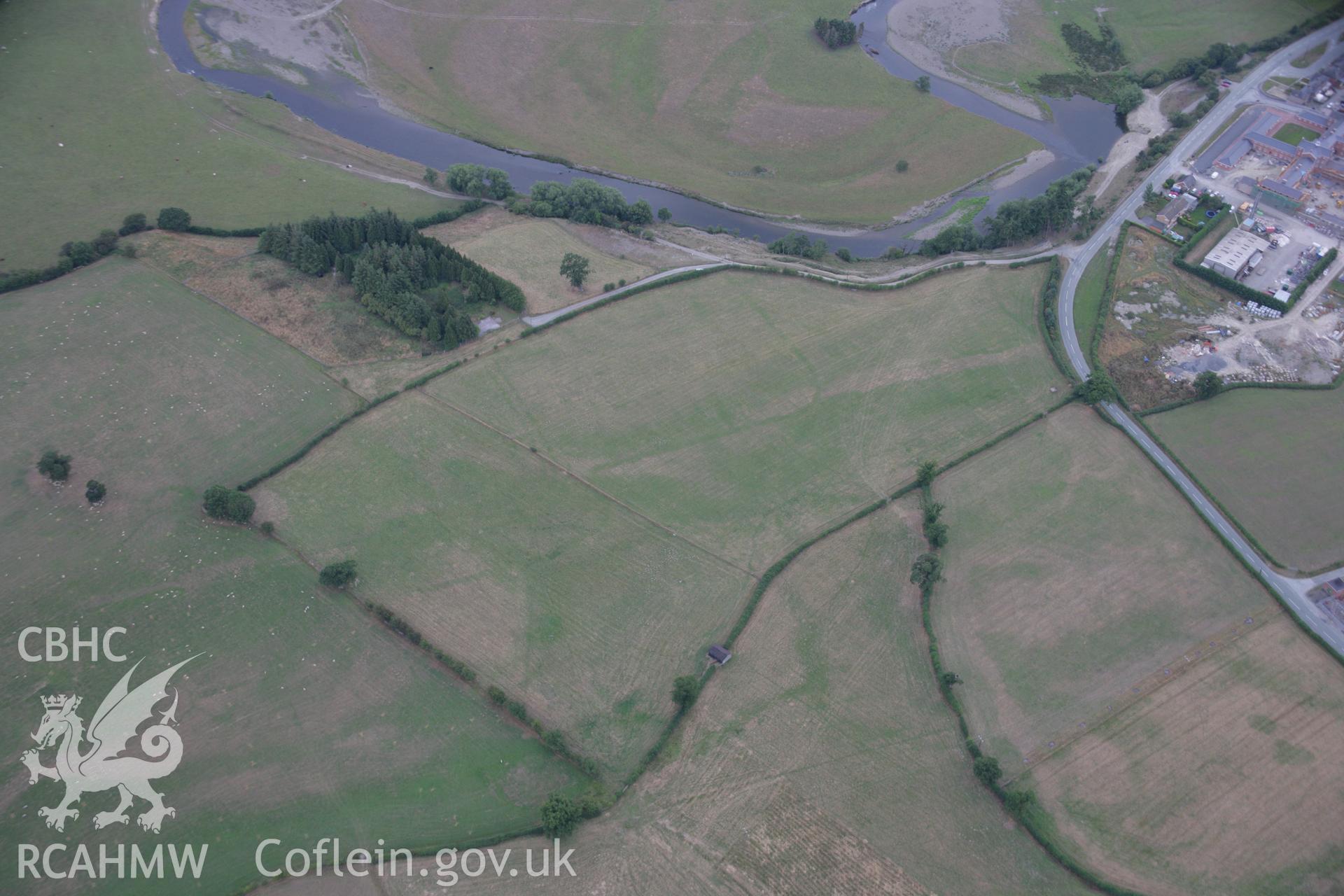 RCAHMW colour oblique aerial photograph showing parchmarks in grass at Llwyn-y-Brain Roman Fort. Taken on 14 August 2006 by Toby Driver.