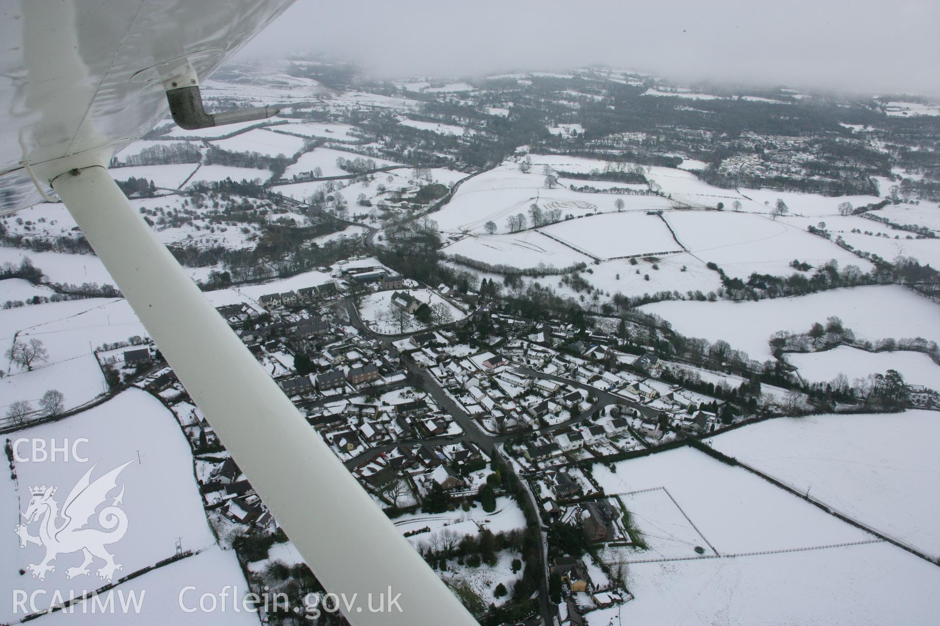 RCAHMW colour oblique aerial photograph of Llanarmon-yn-Ial, viewed from the west. Taken on 06 March 2006 by Toby Driver.
