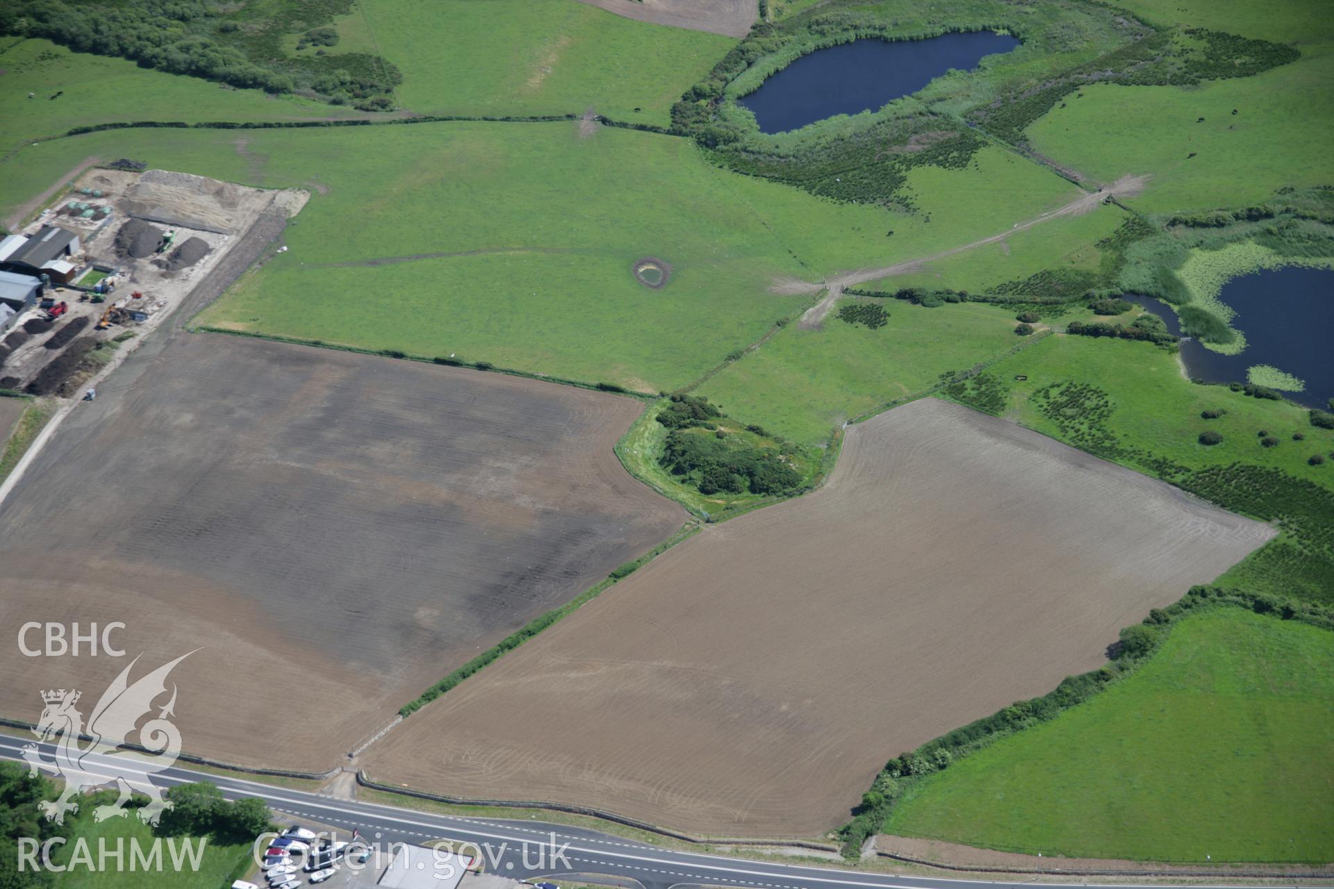 RCAHMW colour oblique aerial photograph of Tomen Fawr from the north. Taken on 14 June 2006 by Toby Driver.