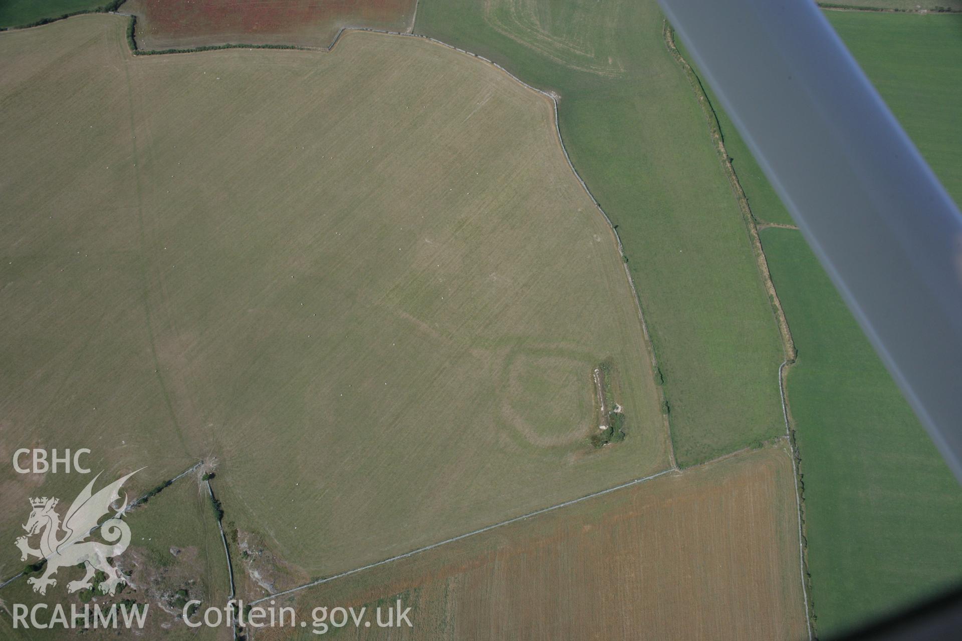 RCAHMW colour oblique aerial photograph of an earthwork enclosure at Llifad. Taken on 14 August 2006 by Toby Driver.