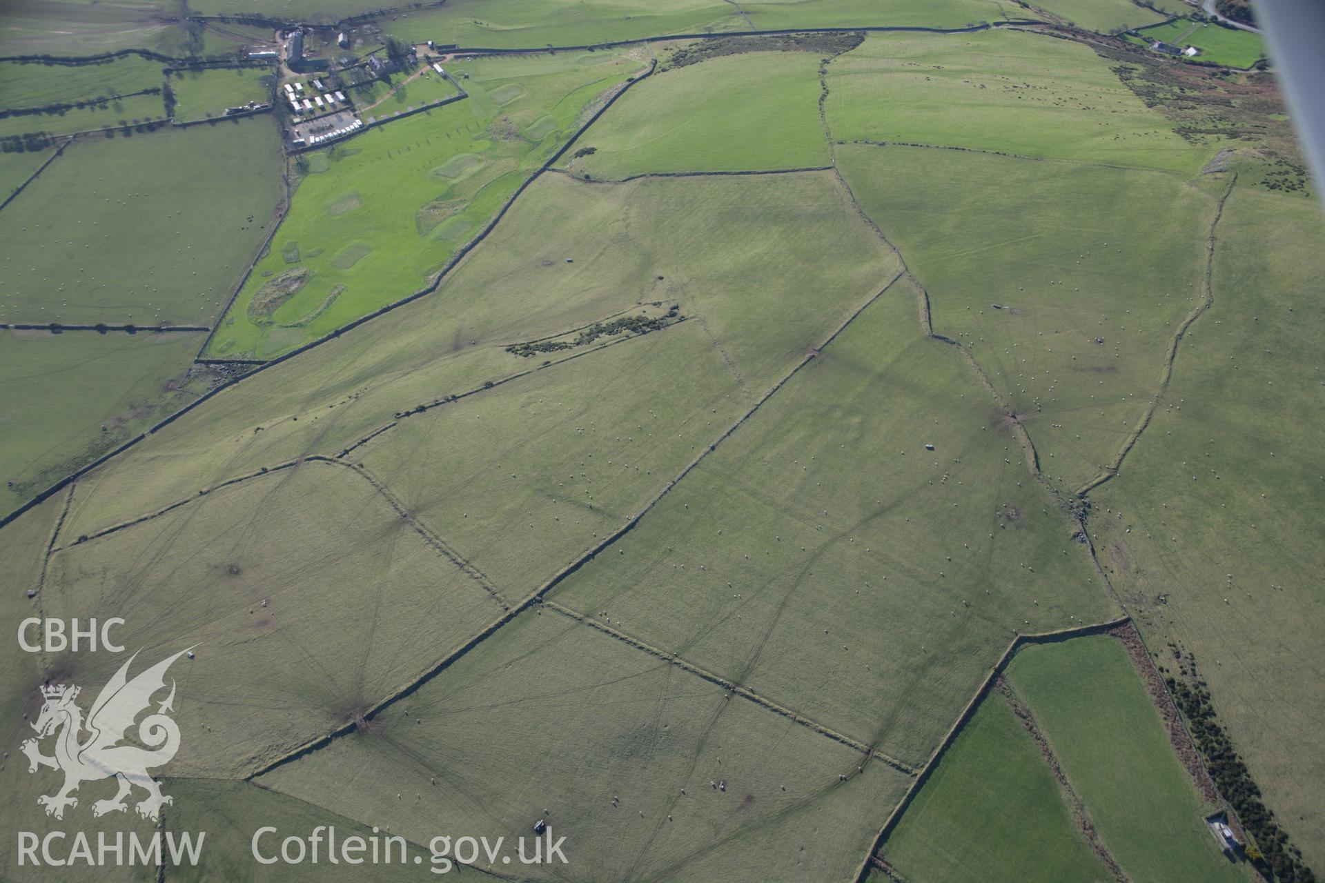 RCAHMW colour oblique aerial photograph of Moel Gwynys Settlement, earthworks, viewed from the east. Taken on 09 February 2006 by Toby Driver.